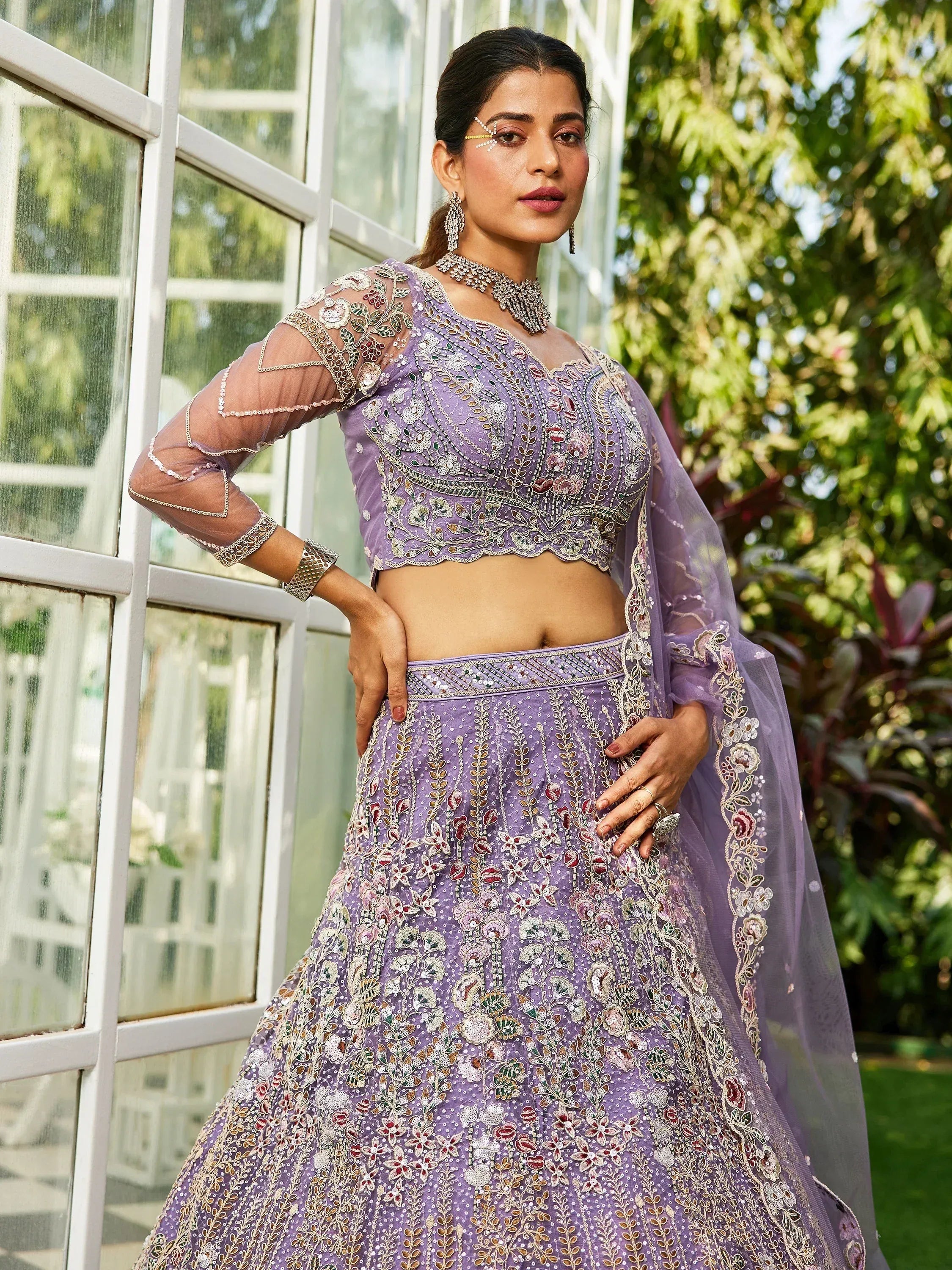 Lavender embroidered lehenga choli with floral motifs, sheer sleeves, and matching dupatta for Indian ethnic wear