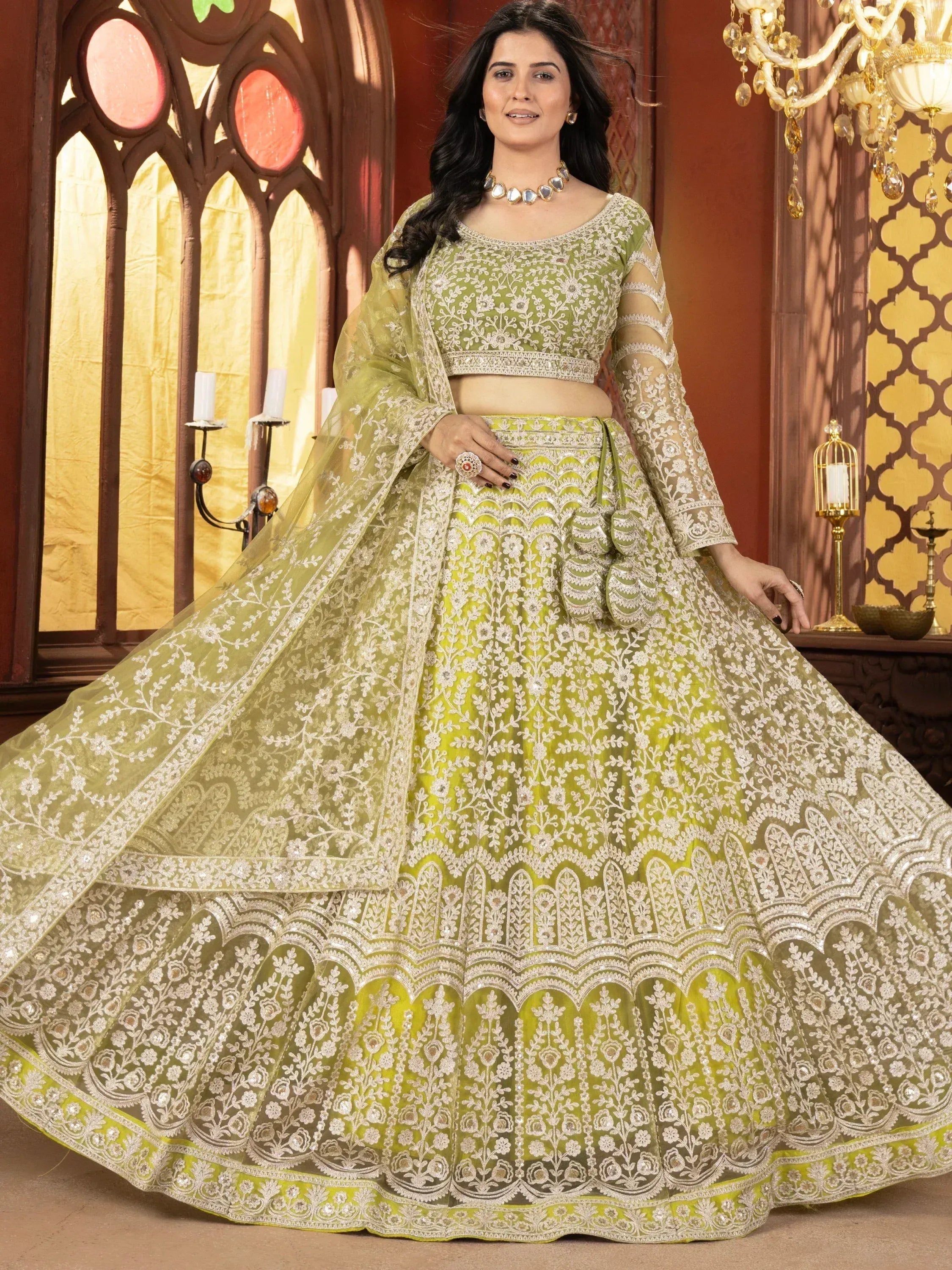 Elegant green embroidered lehenga choli with floral motifs, perfect for Indian weddings and festive occasions.