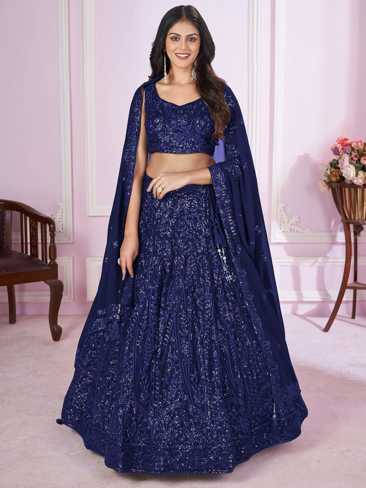 Navy blue designer lehenga choli with intricate embroidery and cape, perfect for weddings and parties