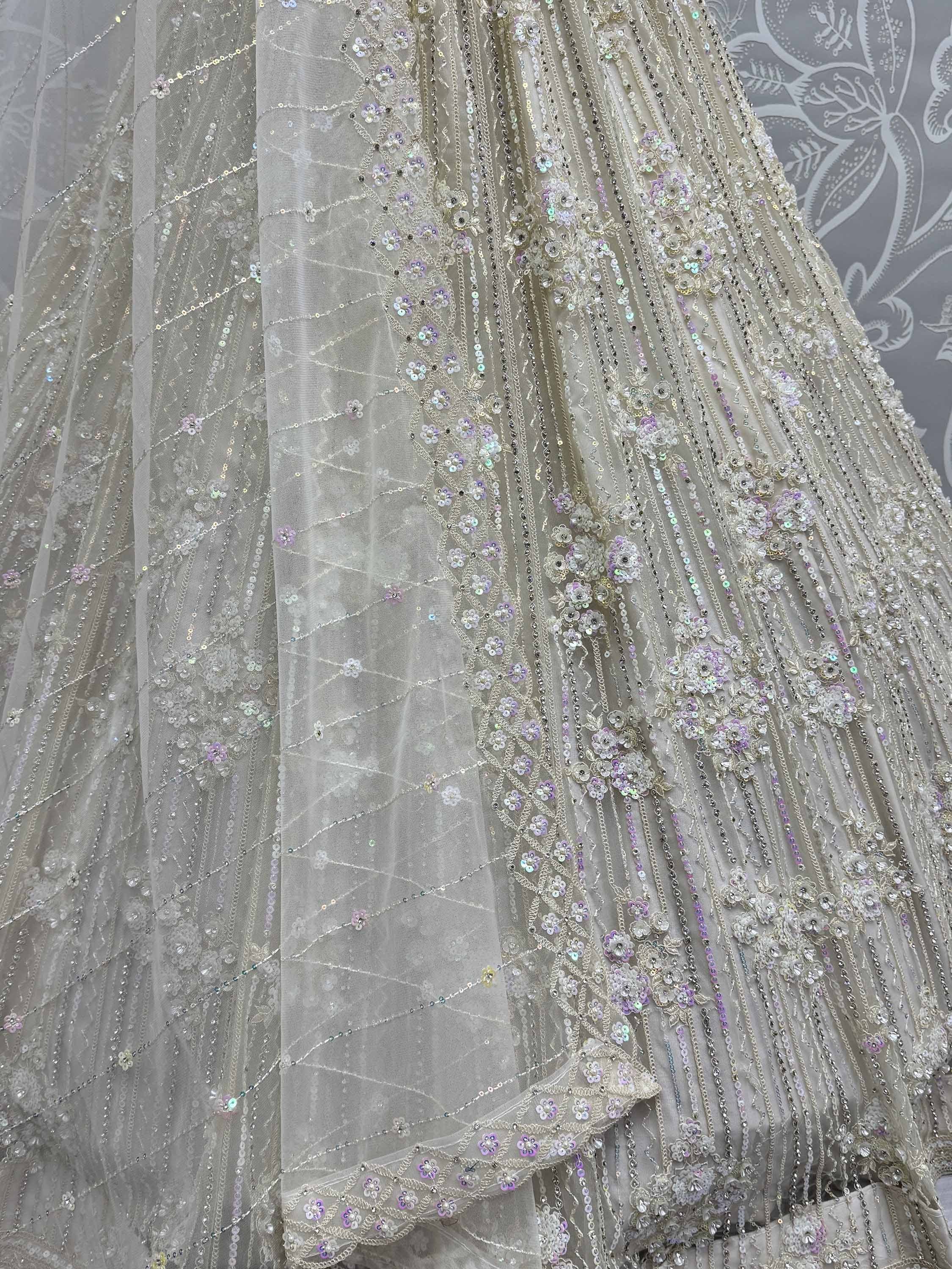 Elegant ivory lehenga with floral sequin embroidery and beadwork for Indian weddings