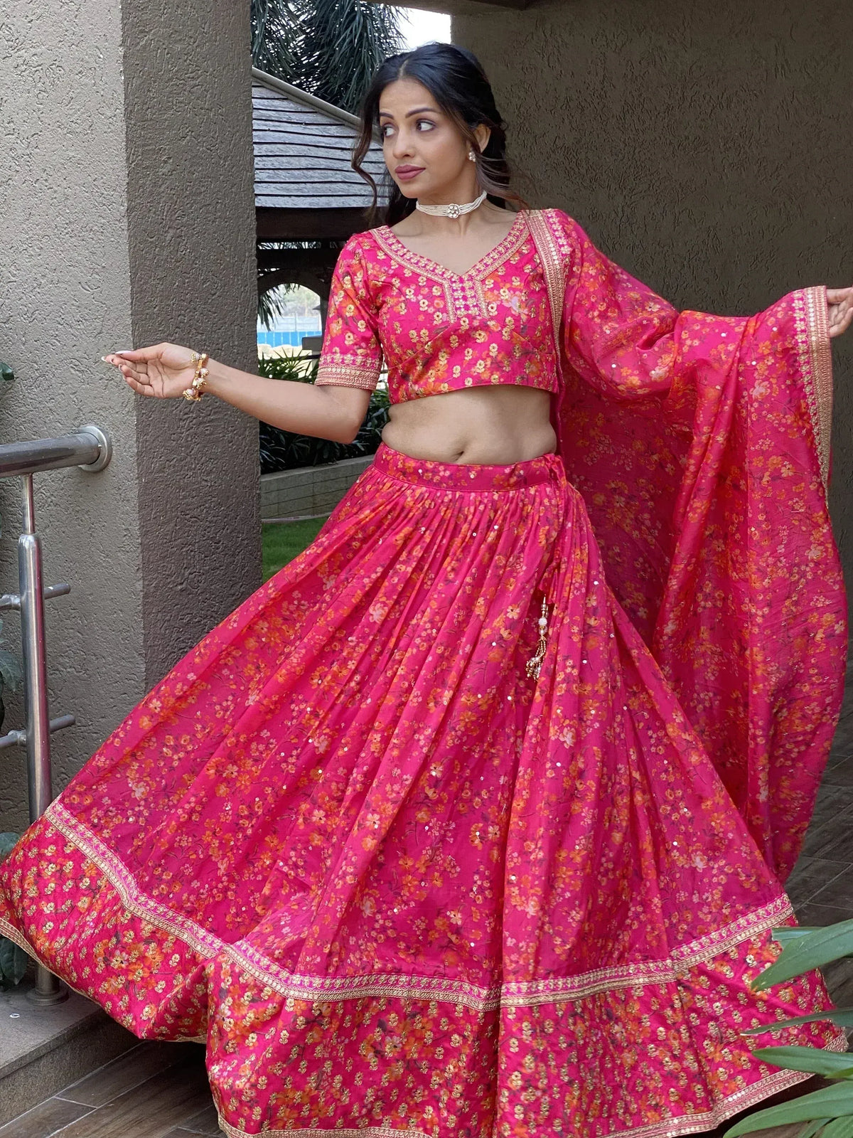 Pink floral lehenga choli with gold embroidery, perfect for Indian ethnic wear and festive occasions.