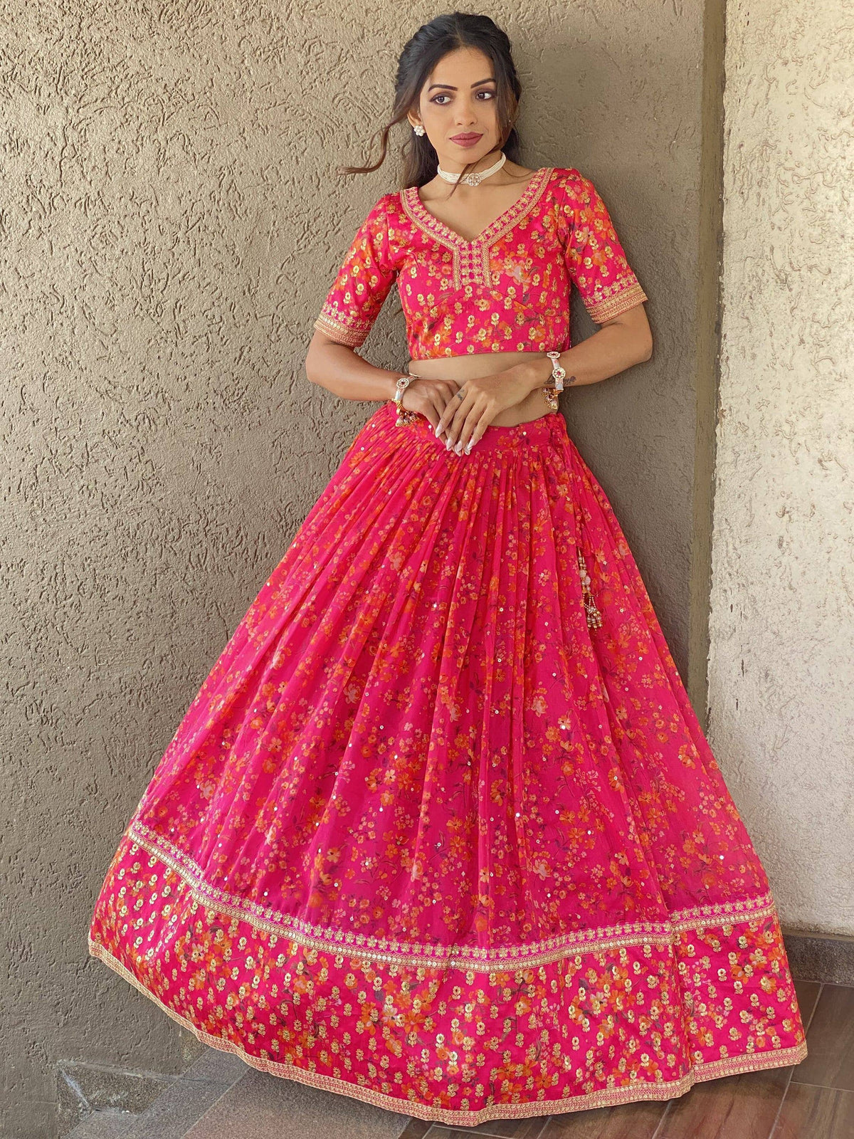 Pink floral lehenga choli with gold embroidery, perfect for Indian ethnic wear occasions