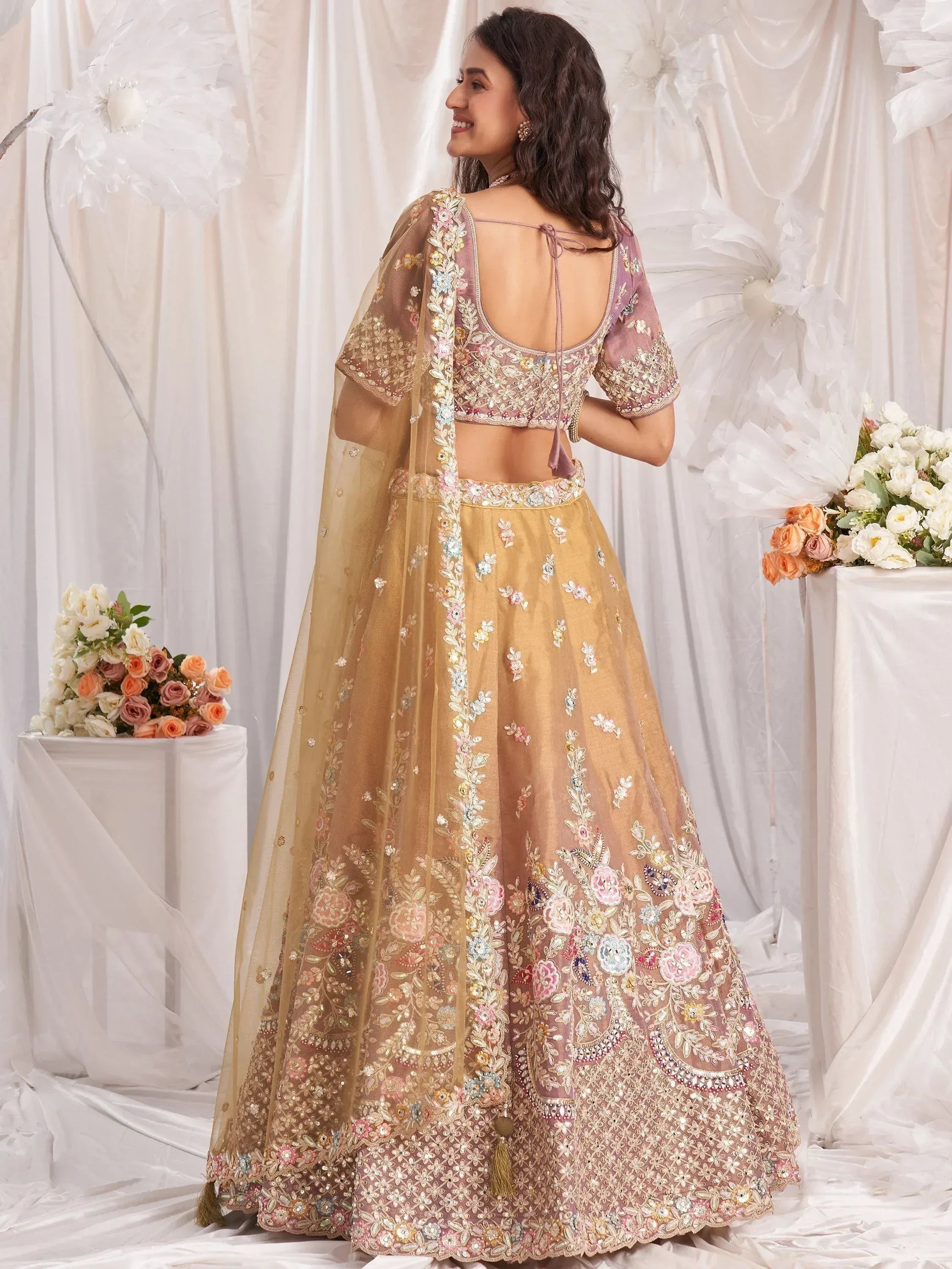 Elegant floral embroidered lehenga choli with sheer dupatta, perfect for weddings and festive occasions