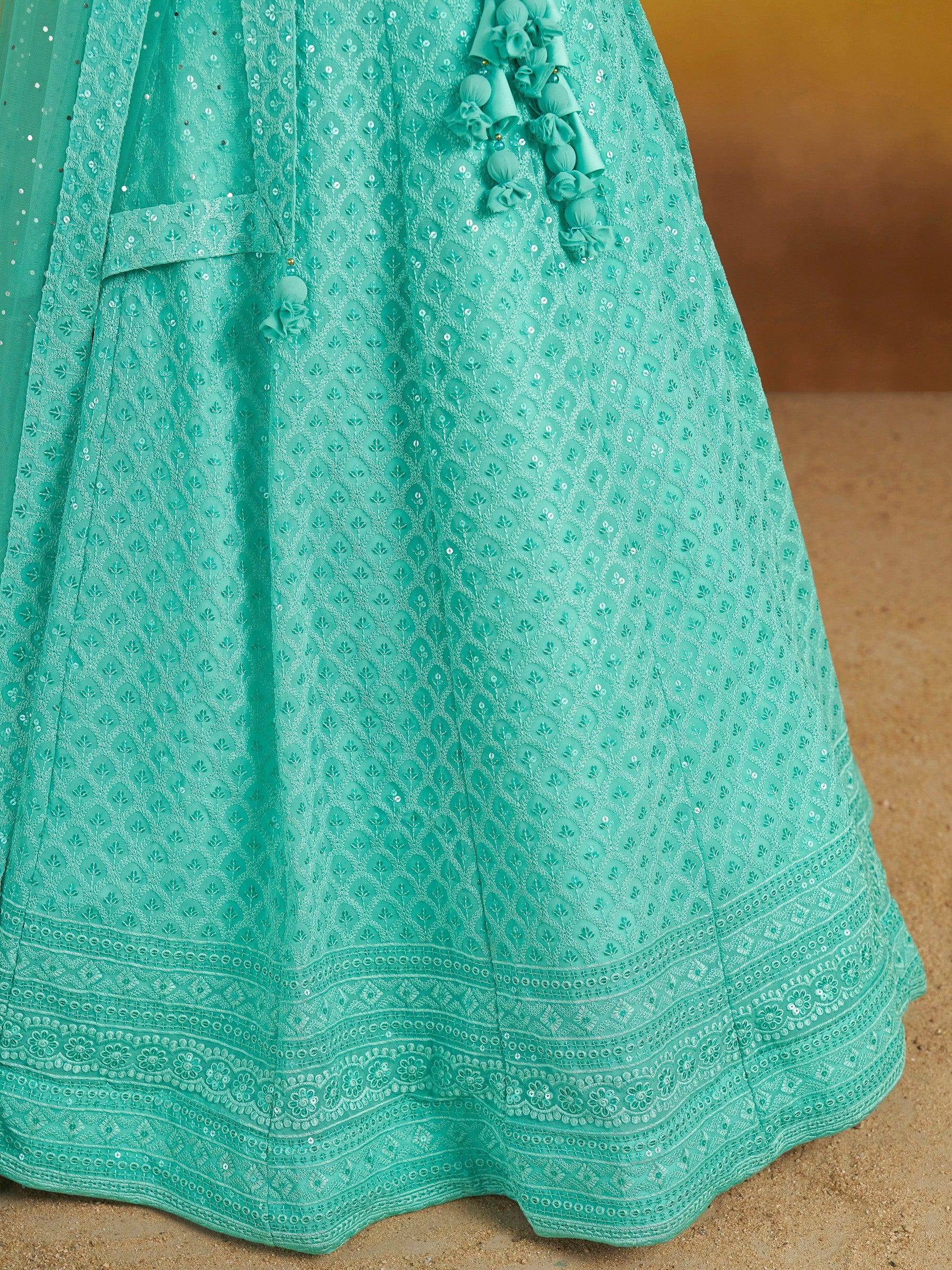 Mint green embroidered lehenga with floral patterns and sequin detailing, perfect for Indian ethnic wear.