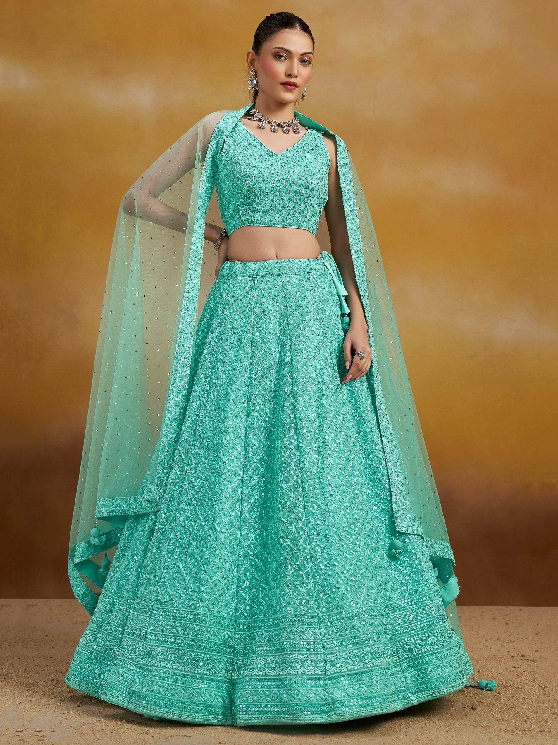 Mint green embroidered lehenga choli with sheer dupatta, perfect for Indian ethnic wear and festive occasions.