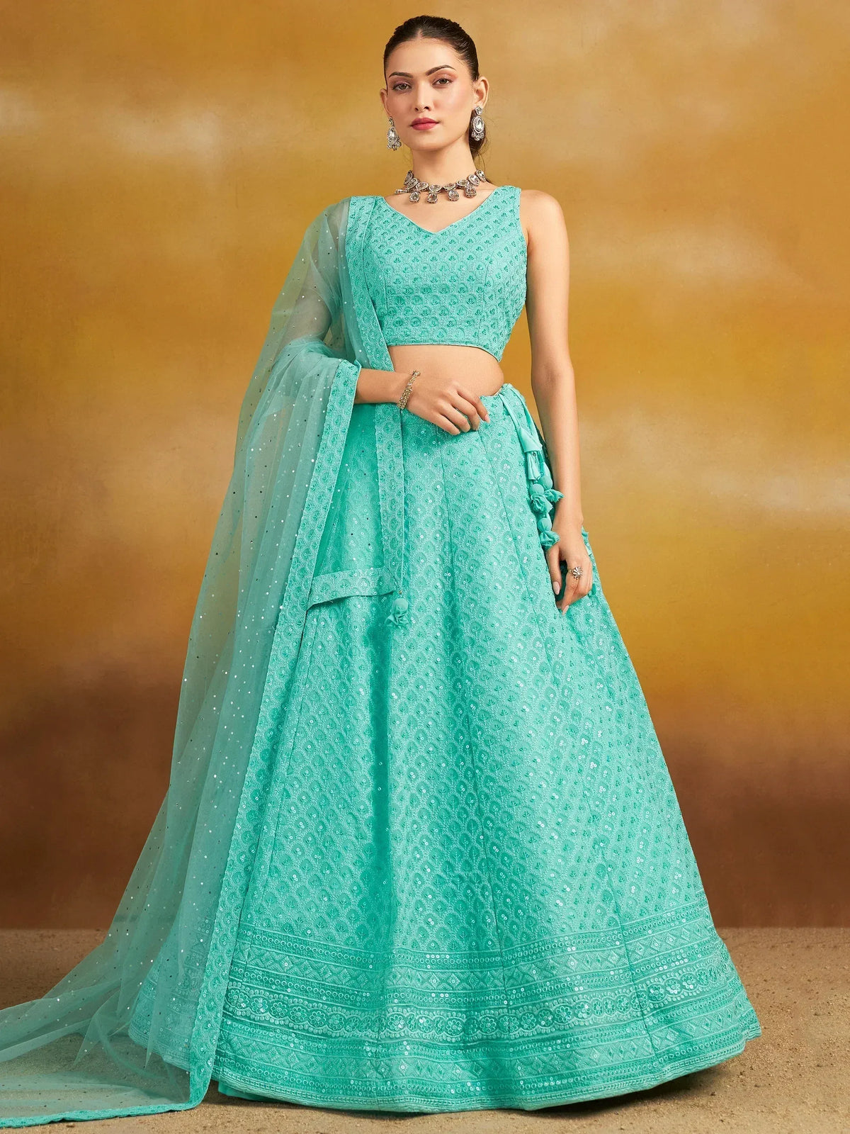 Mint green designer lehenga choli with sequin embroidery and sheer dupatta, perfect for Indian ethnic occasions