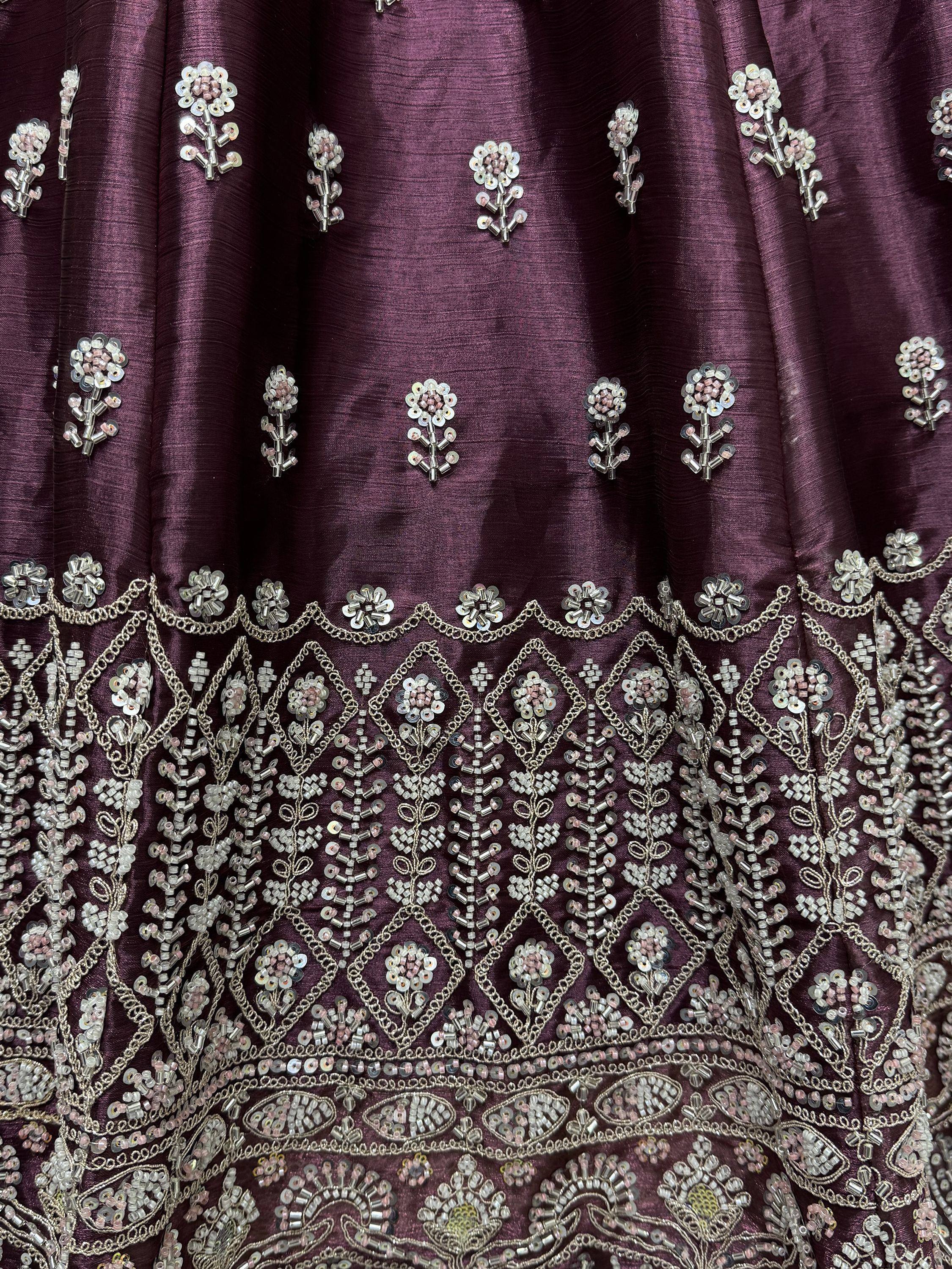 Purple ethnic gown with intricate silver bead and sequin floral embroidery, perfect for Indian occasions.