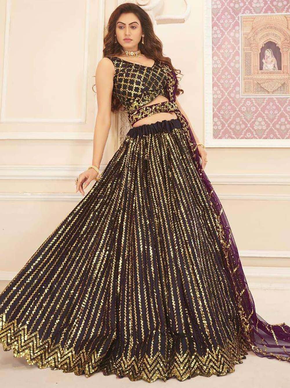 Black and gold designer lehenga choli with sequin work, perfect for Indian ethnic occasions