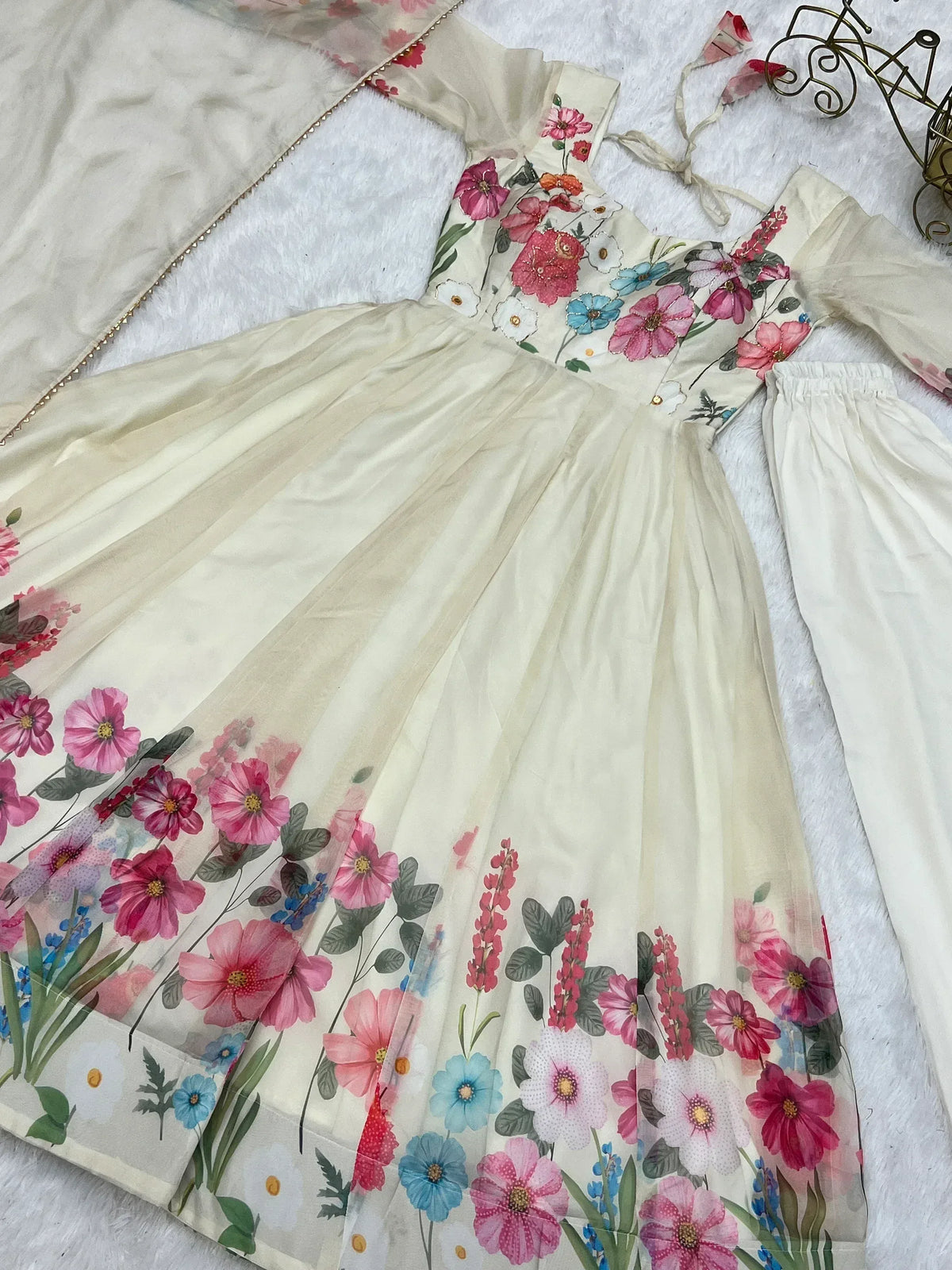 Floral printed ethnic gown with vibrant flowers, perfect for Indian celebrations and festive occasions.