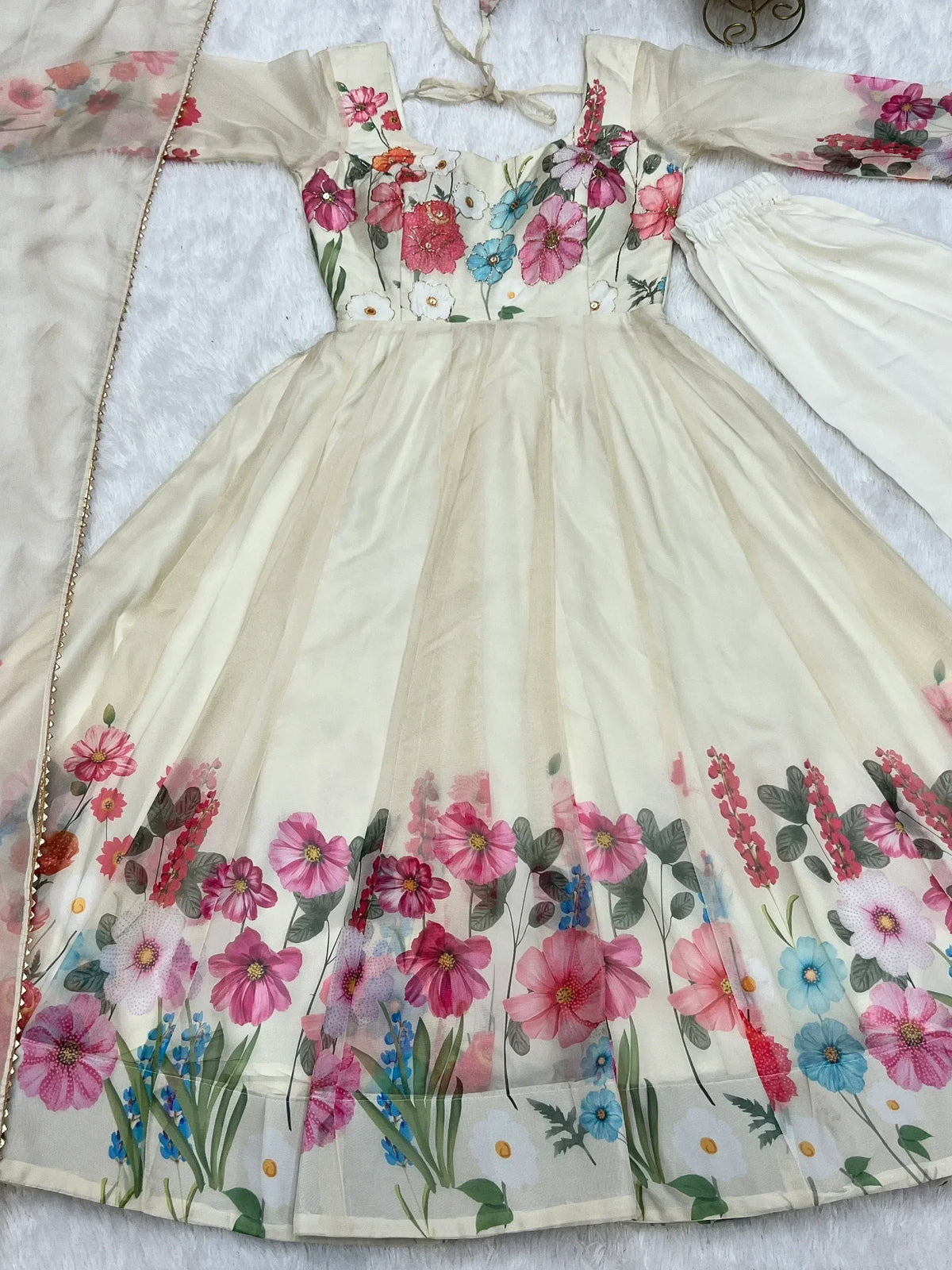 Floral printed ethnic gown with vibrant pink and blue flowers, perfect for festive occasions