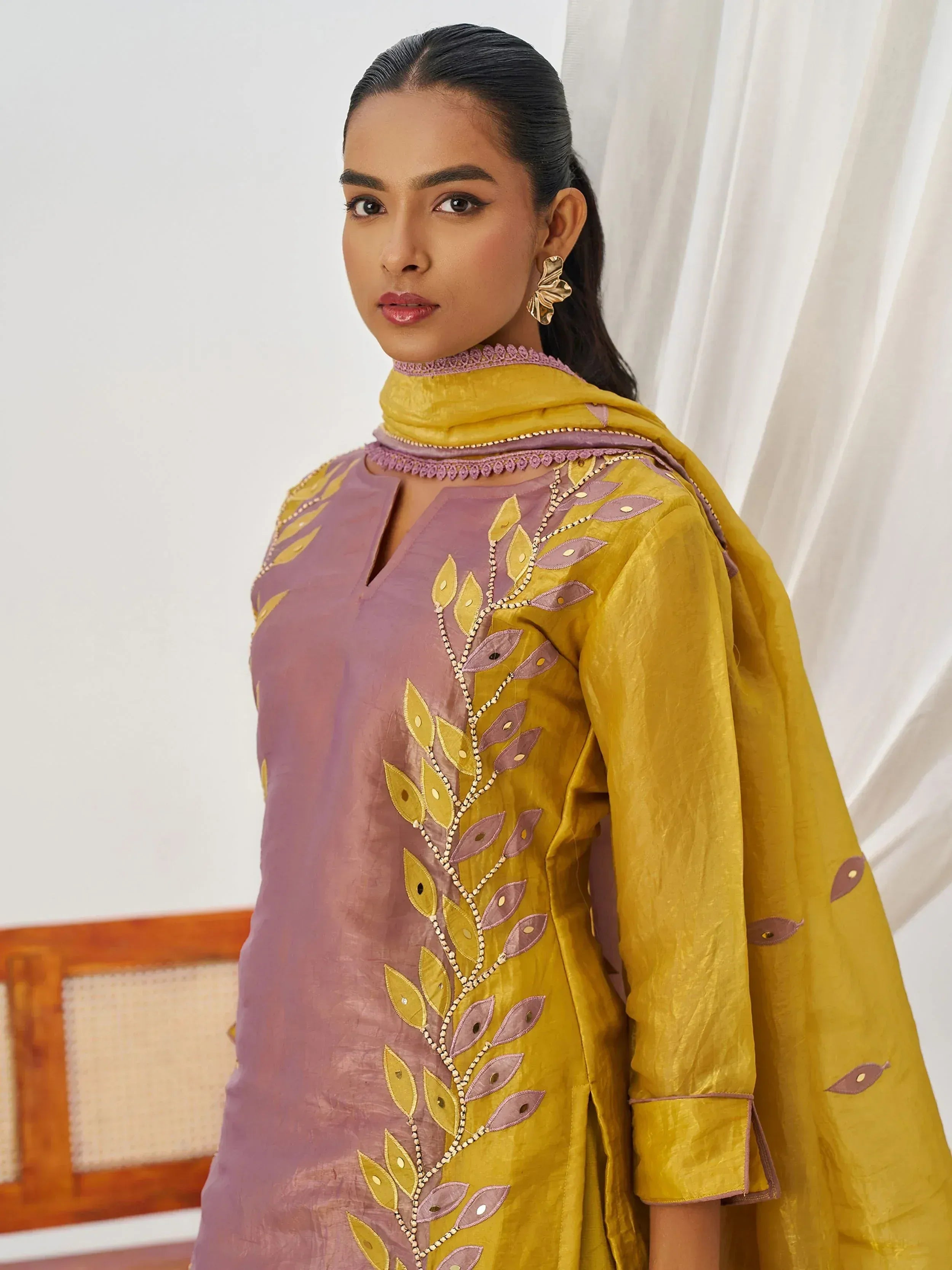 Purple and mustard yellow embroidered salwar kameez with leaf motif, perfect for ethnic occasions