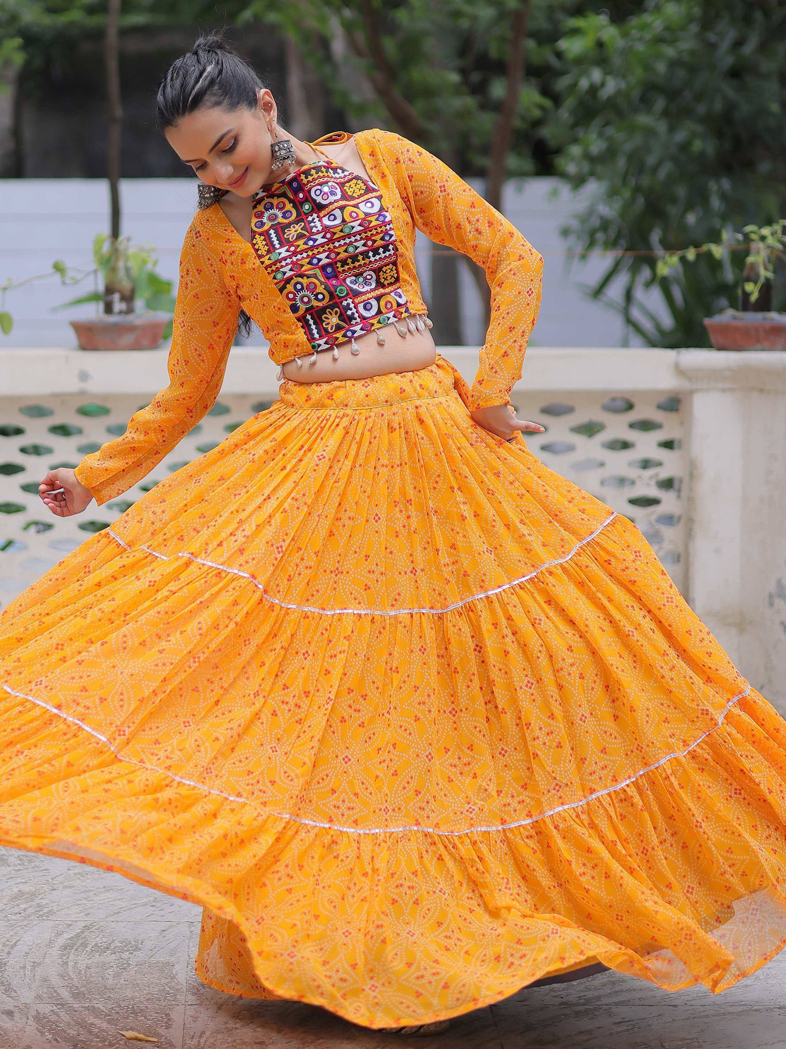 Vibrant yellow ethnic lehenga with embroidered crop top, perfect for festive occasions and traditional celebrations.
