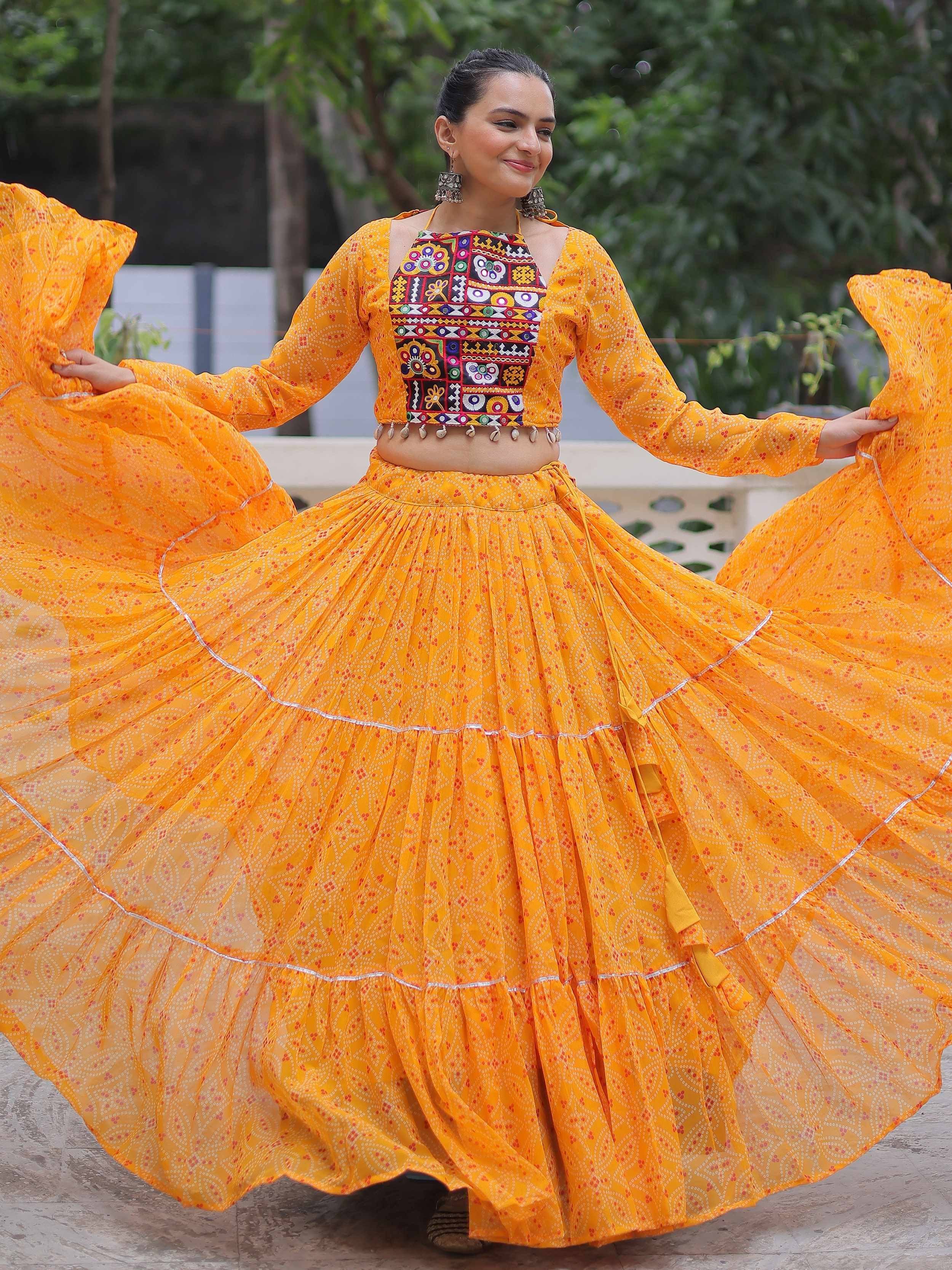 Vibrant yellow ethnic lehenga choli with colorful embroidery, perfect for festive occasions.