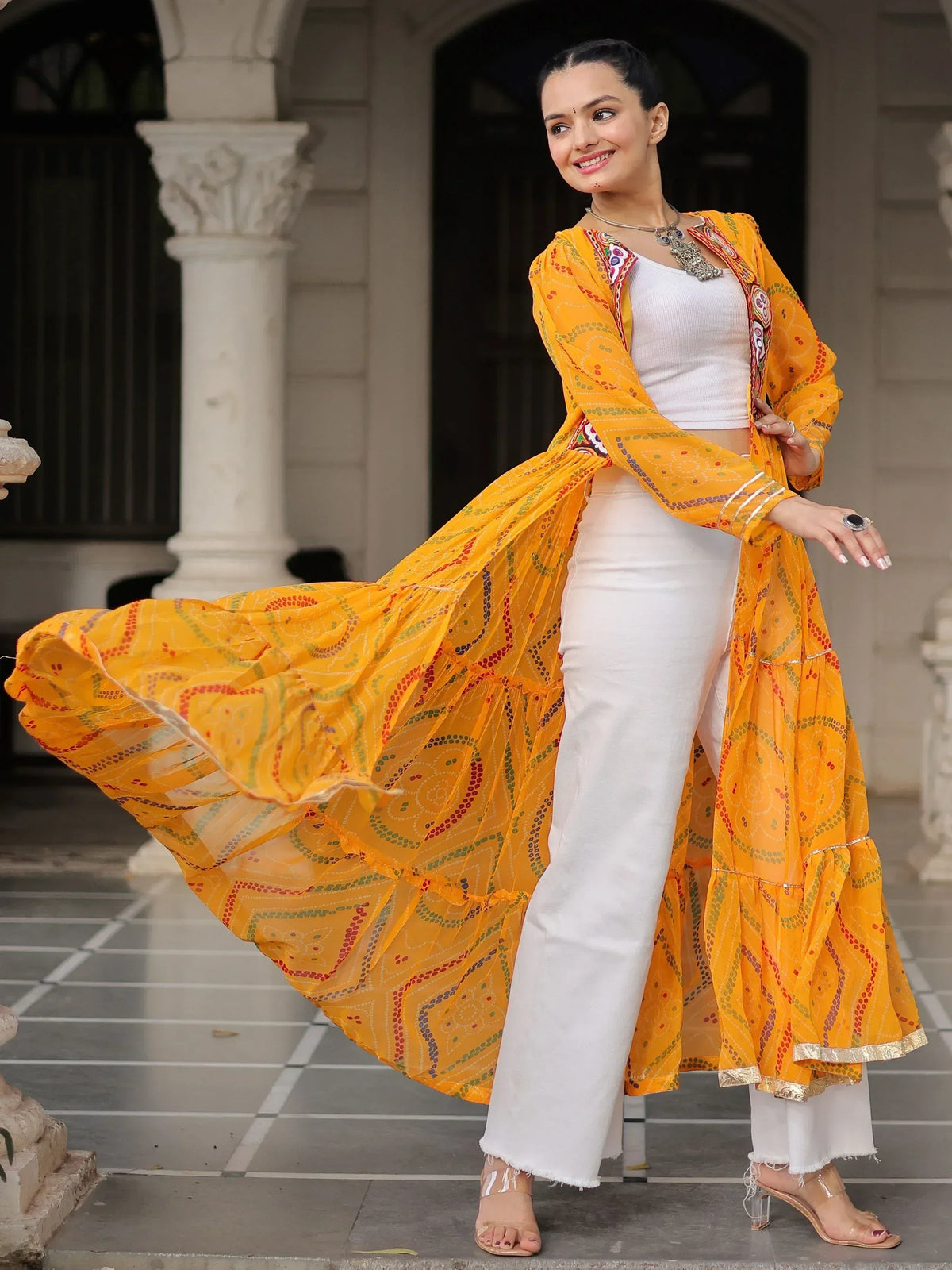 Vibrant yellow printed ethnic jacket with white palazzo pants, perfect for Indian festive wear or casual ethnic style.
