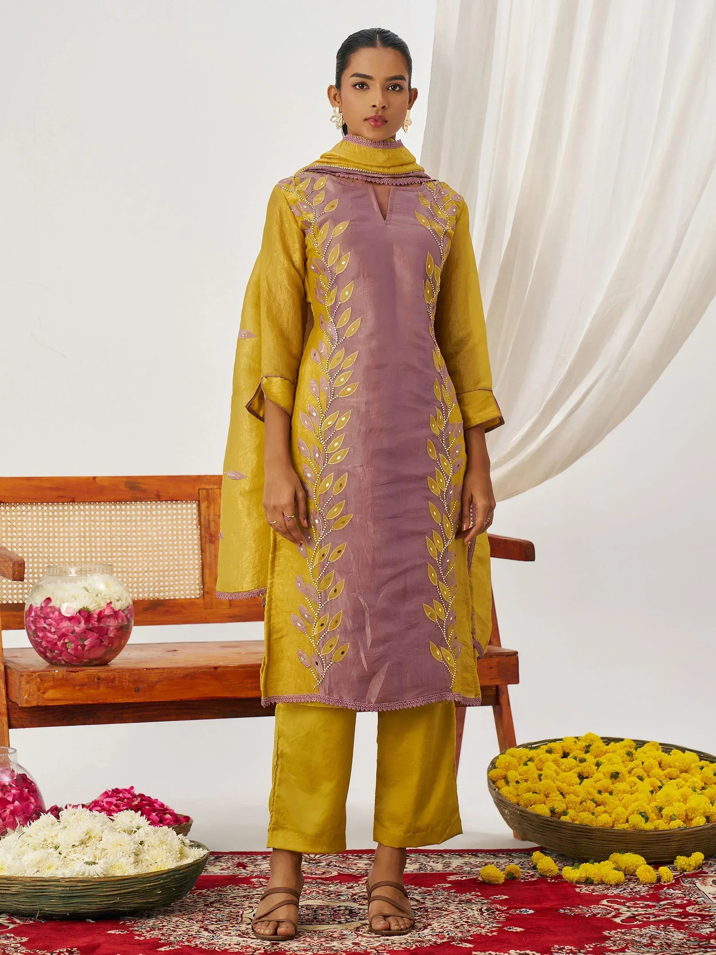 Purple and mustard yellow embroidered salwar kameez with floral motifs, perfect for Indian ethnic wear