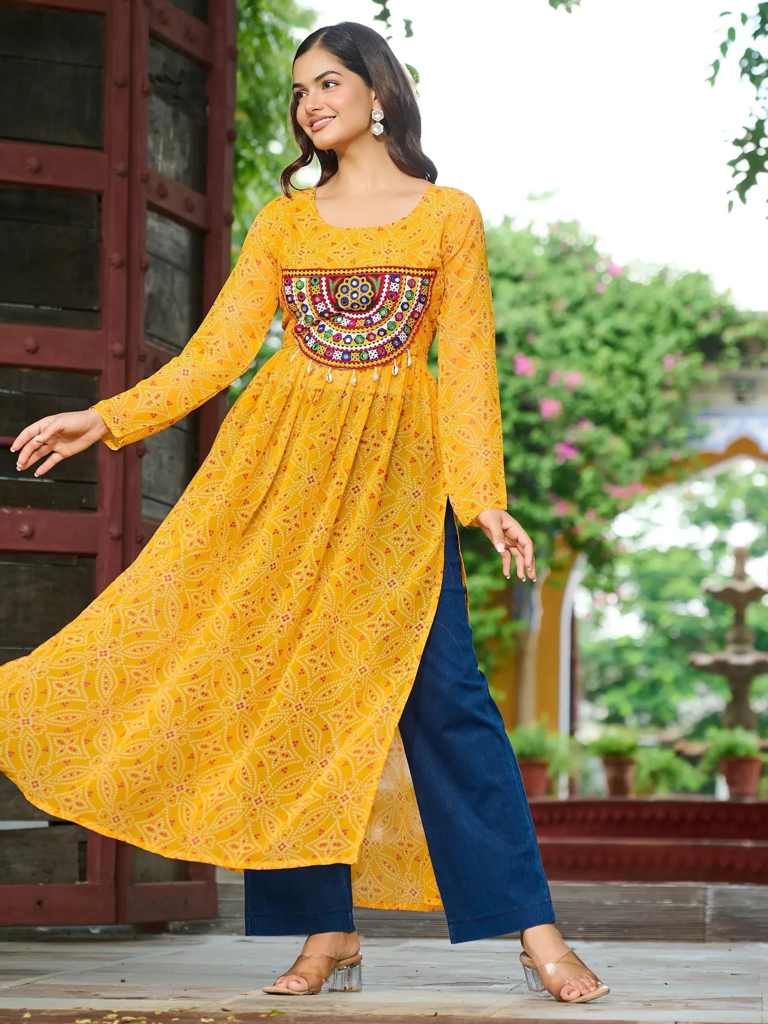 Yellow printed kurta with mirror work and blue palazzo pants, ethnic Indian wear