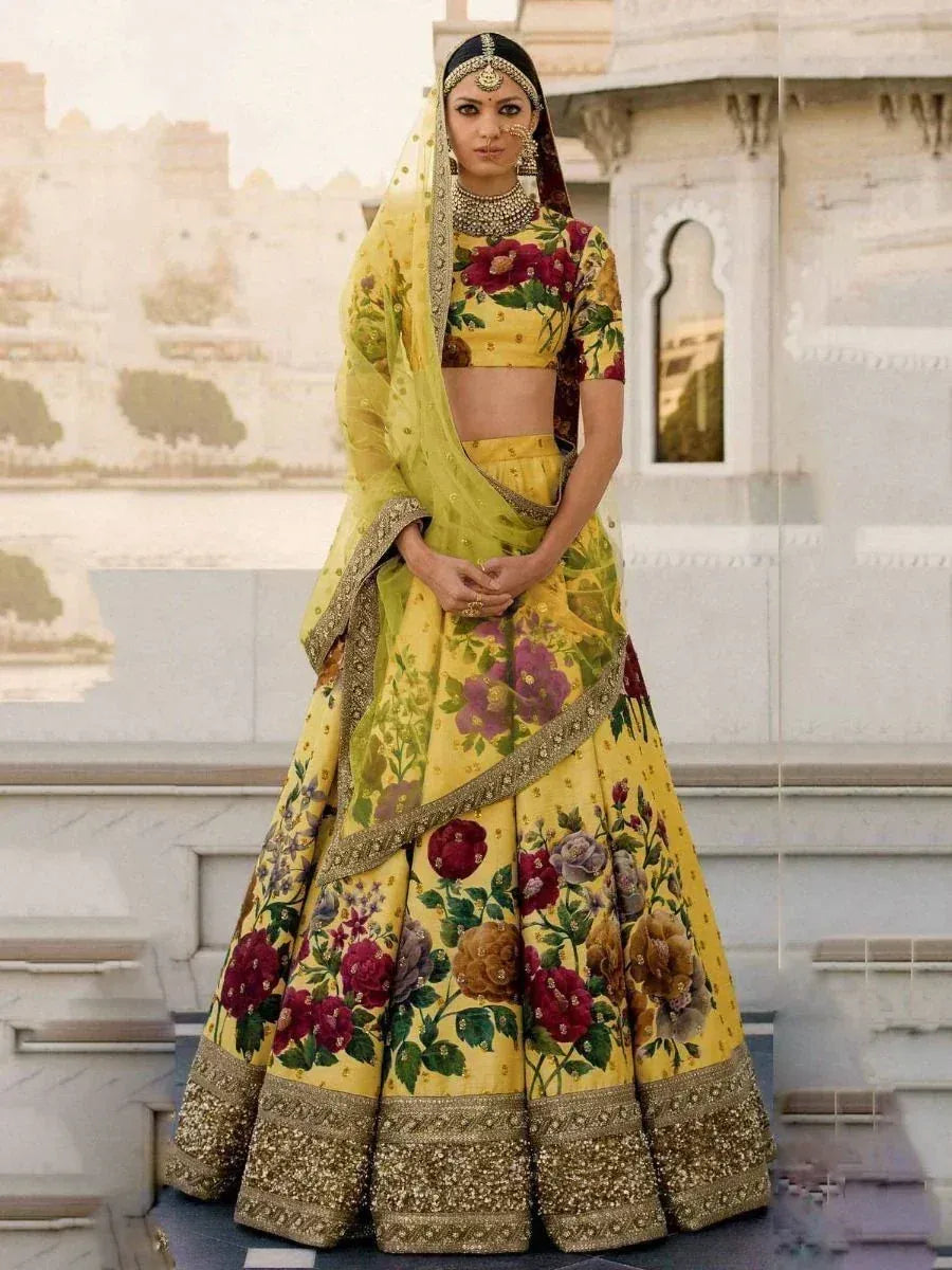 Yellow floral lehenga choli with gold embroidery, perfect for Indian weddings and ethnic events