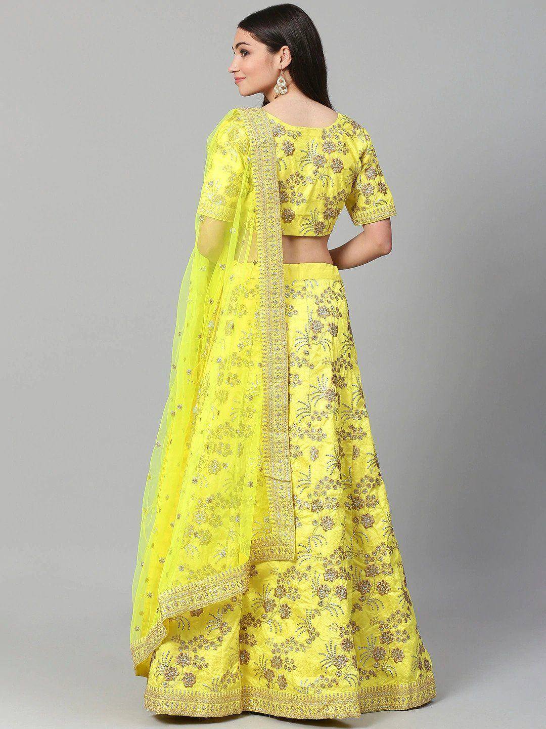 Yellow embroidered lehenga choli with floral zari work, perfect for Indian ethnic occasions