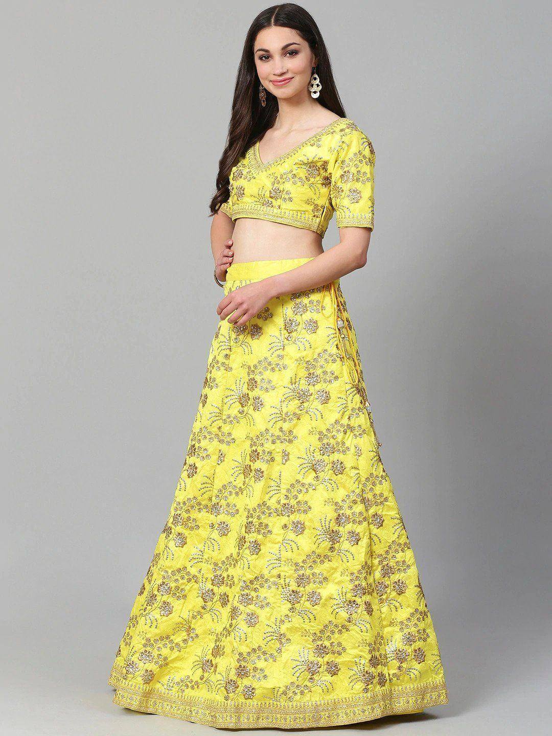 Yellow embroidered lehenga choli with floral gold detailing, perfect for Indian ethnic wear occasions