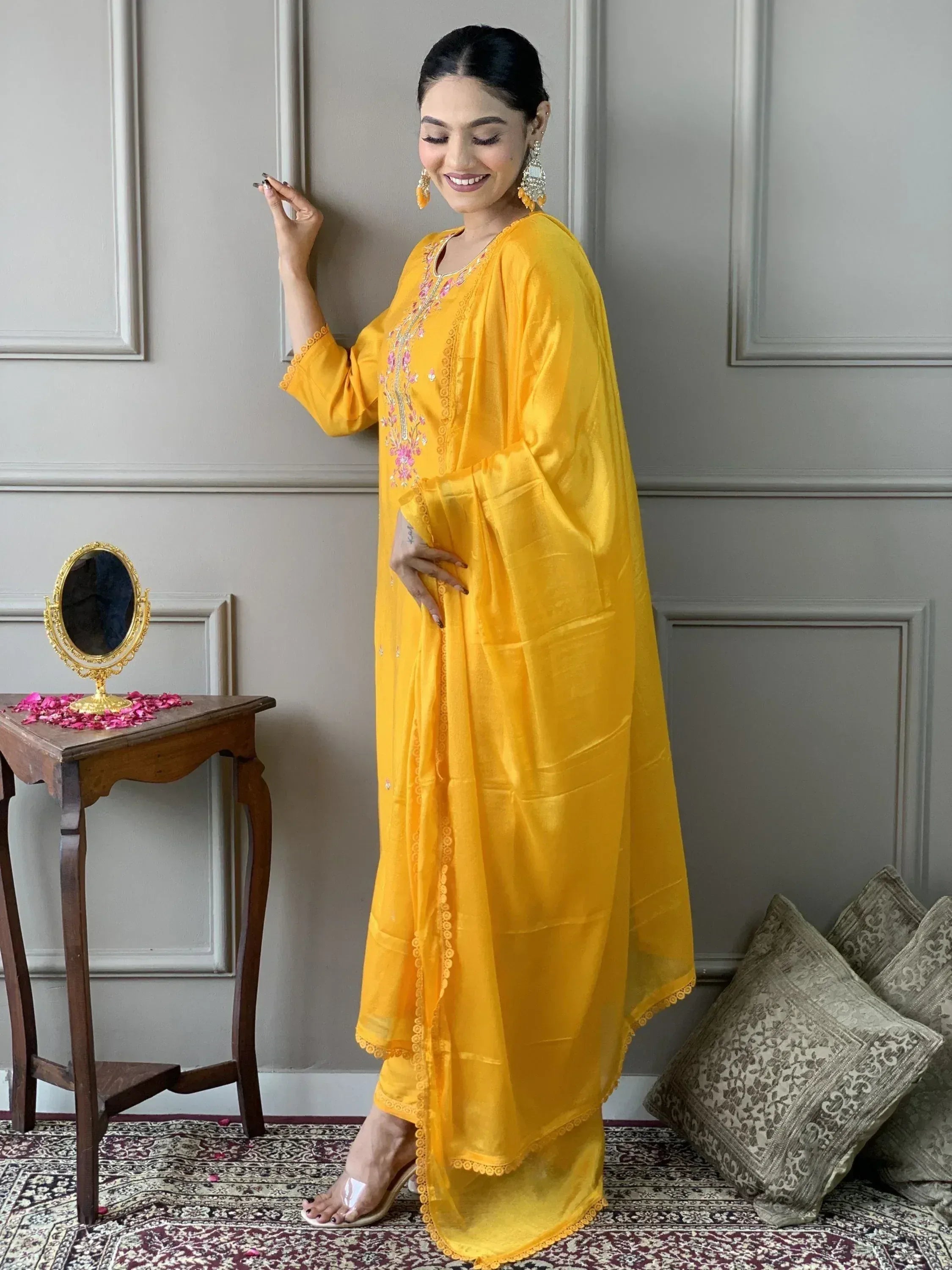 Yellow embroidered ethnic salwar kameez with floral detailing, perfect for Indian festive occasions