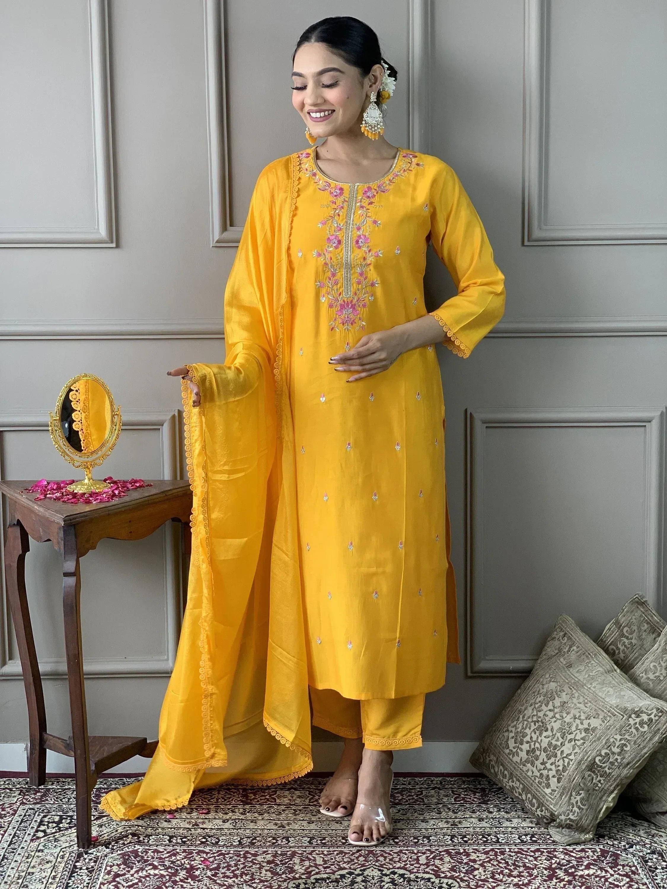 Yellow embroidered salwar kameez with floral detailing and matching dupatta for ethnic wear