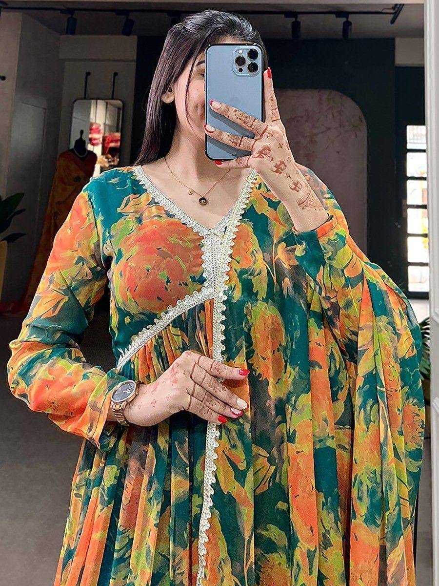 Vibrant floral ethnic gown with lace detailing, perfect for Indian occasions and festive wear.