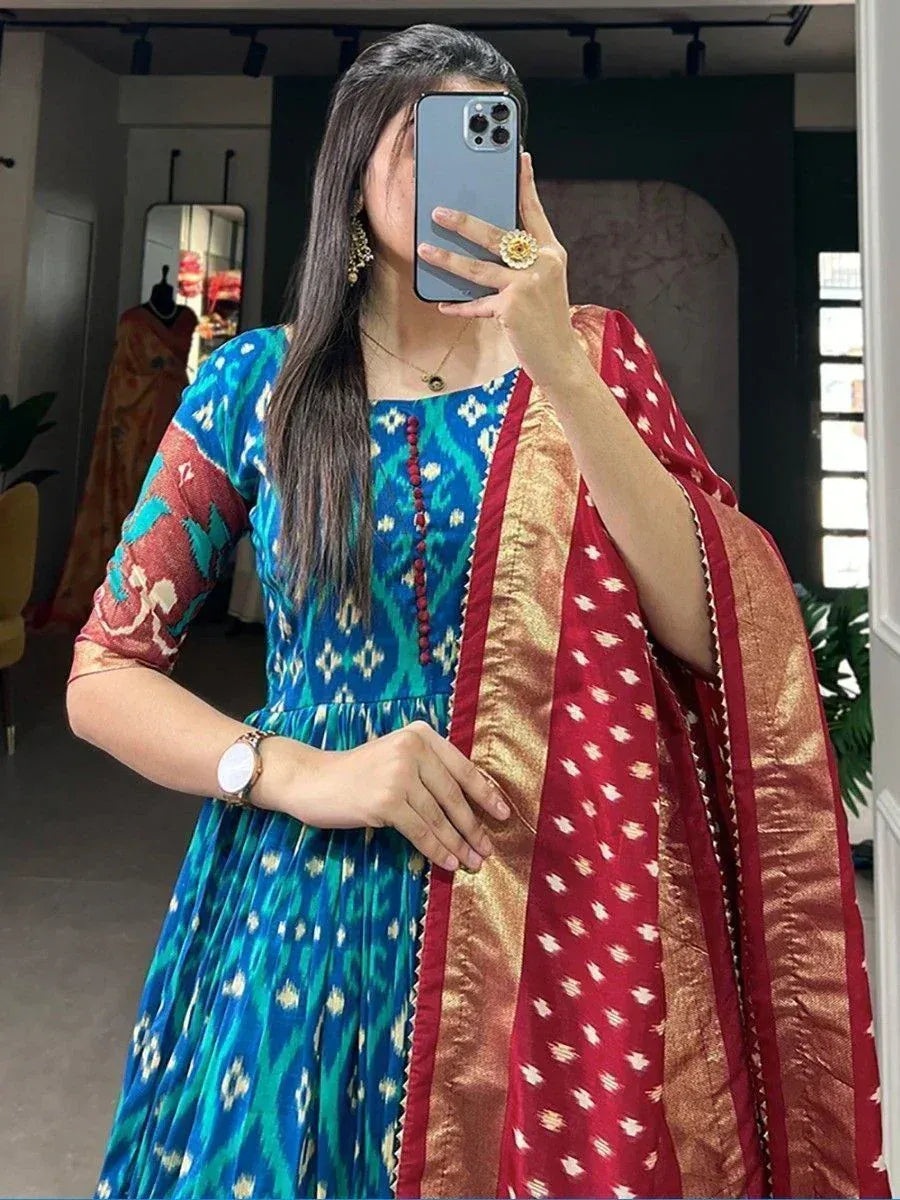 Blue ikat print ethnic gown with red gold dupatta, perfect for Indian occasions