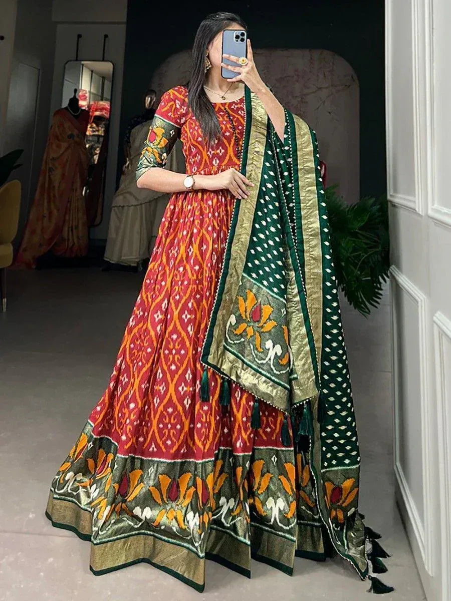 Red and green printed ethnic anarkali suit with floral dupatta, perfect for Indian weddings and festive occasions