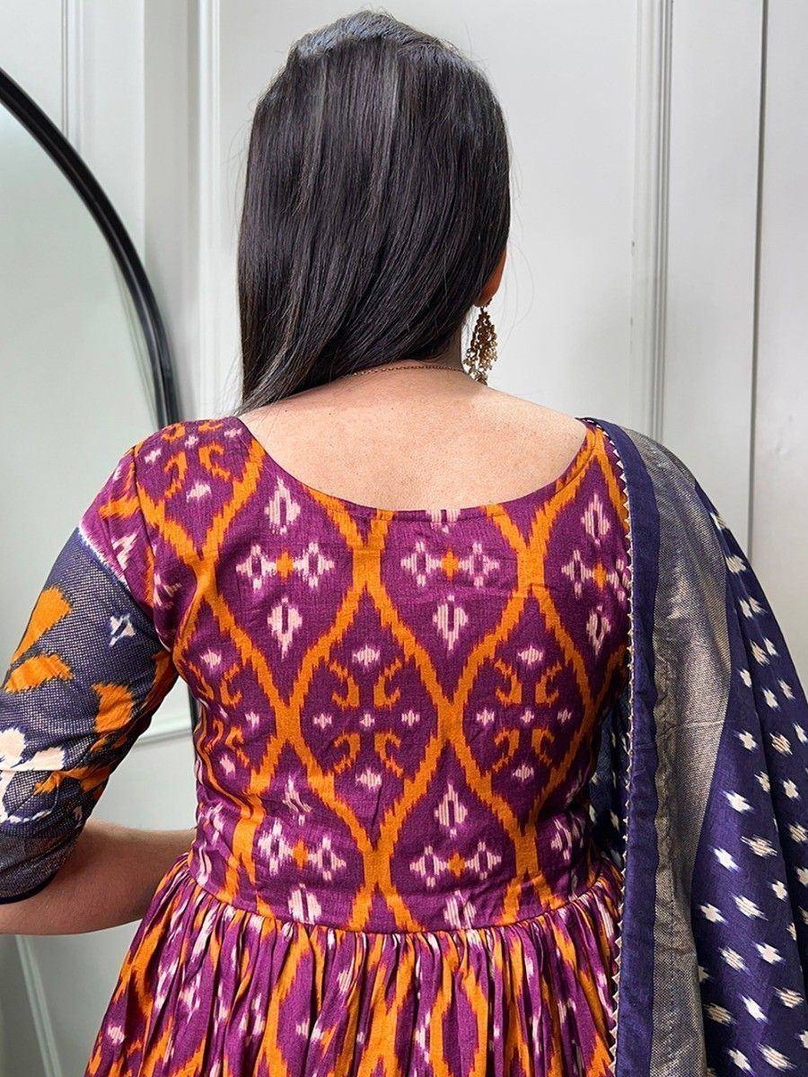 Purple and orange ikat print ethnic gown with back neckline, paired with matching dupatta