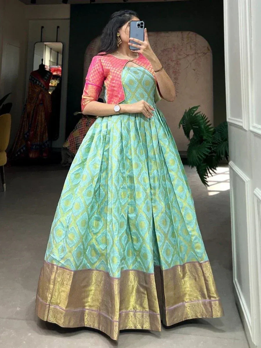 Turquoise and gold ethnic gown with pink blouse, perfect for Indian weddings or festive occasions