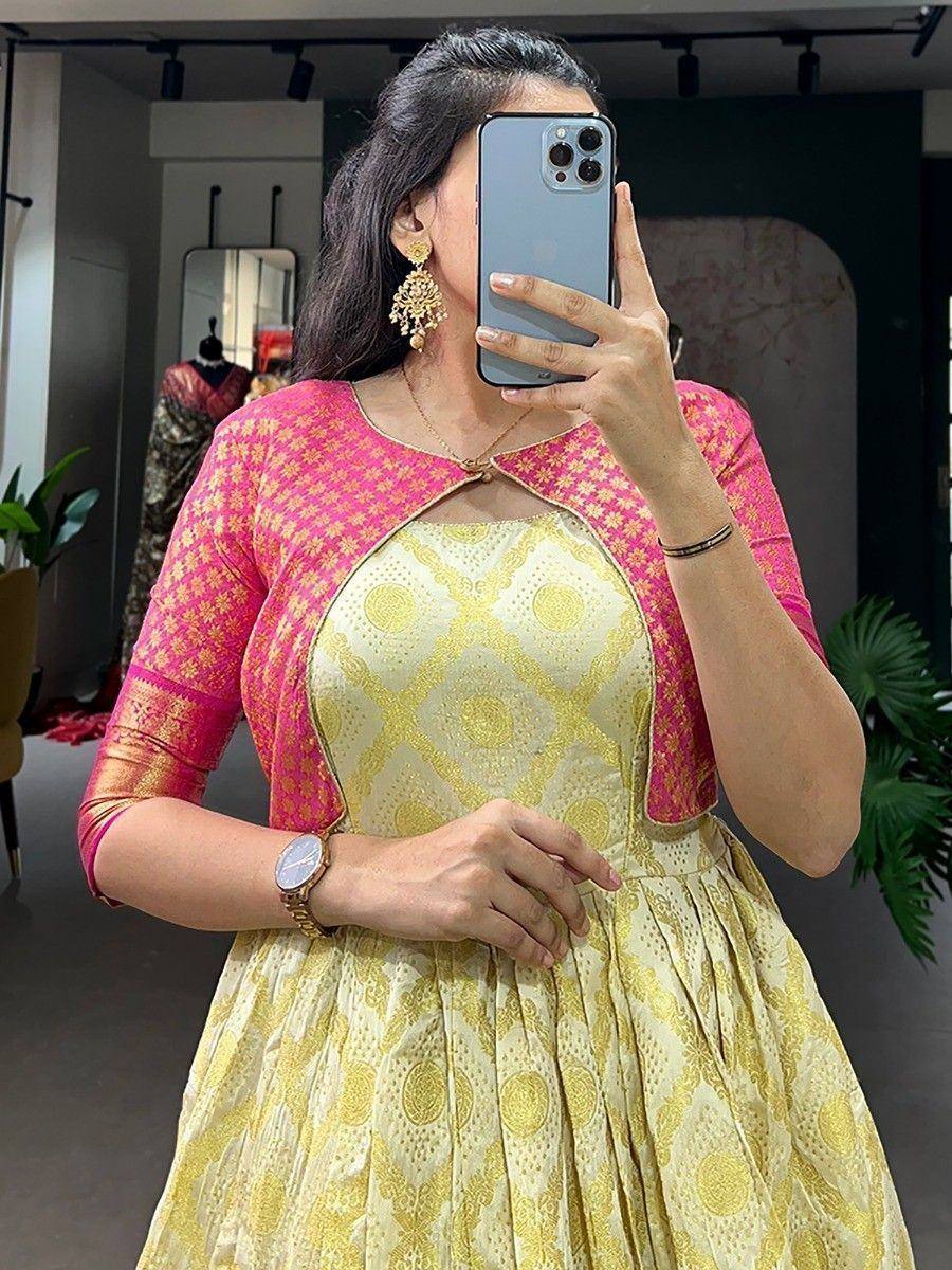 Yellow and pink ethnic gown with floral print, perfect for Indian occasions and festive wear.