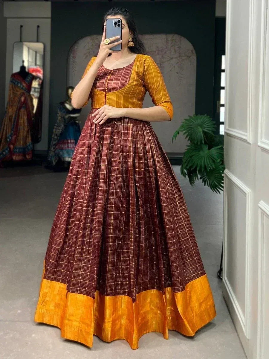 Maroon and mustard ethnic gown with pleated skirt, perfect for Indian occasions and festive wear.