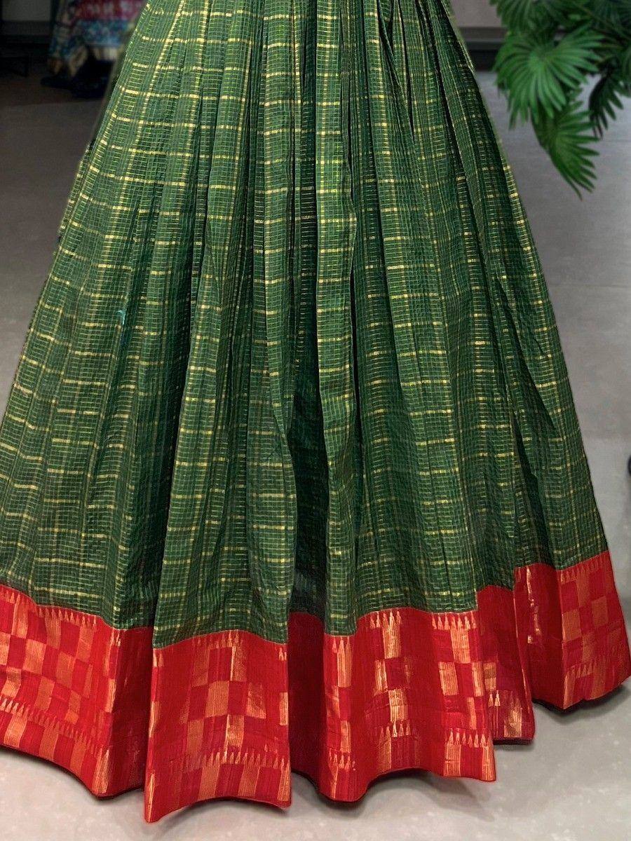 Green and red ethnic lehenga skirt with gold checkered pattern and pleated design