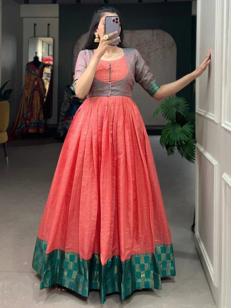 Coral and green ethnic gown with pleated skirt, perfect for Indian occasions and festive wear.