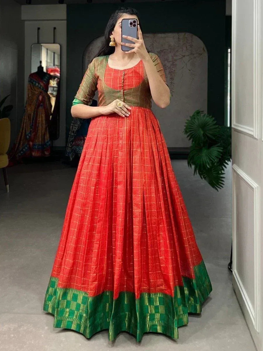 Red and green ethnic anarkali gown with pleated skirt, perfect for Indian occasions and festive wear.
