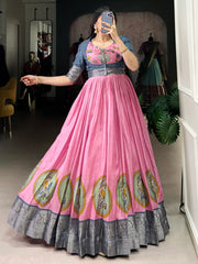 Woman modeling pink ethnic gown with silver border and traditional motifs at Ethnic Plus