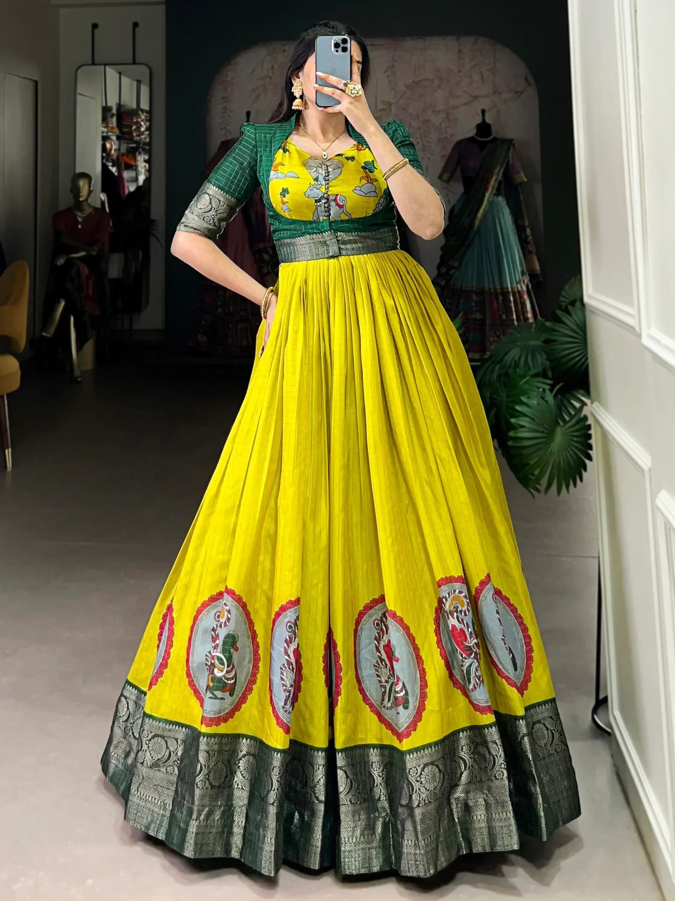 Yellow and green ethnic lehenga choli with printed motifs and silver border, perfect for festive occasions.
