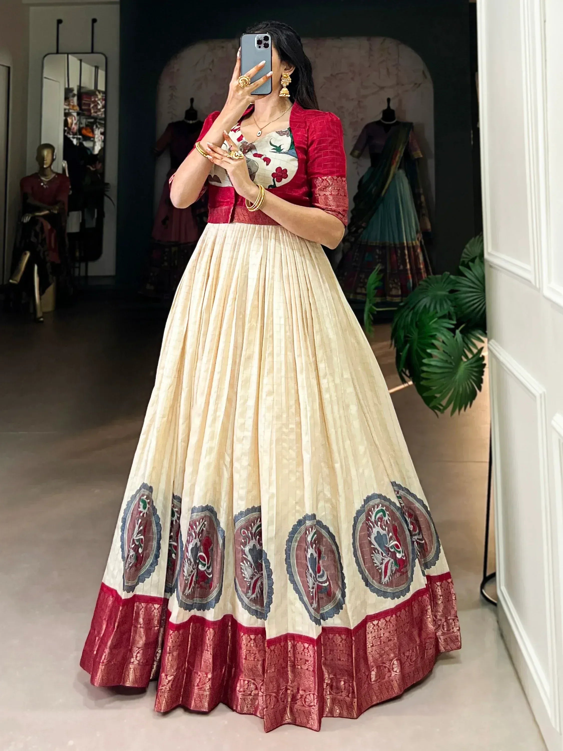 Elegant cream and red lehenga choli with floral embroidery and pleated skirt for Indian ethnic wear