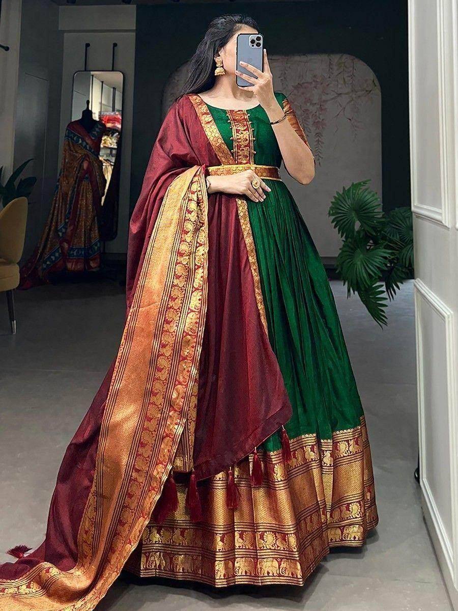 Green and maroon designer lehenga choli with gold embroidery and elephant border, perfect for Indian ethnic wear.