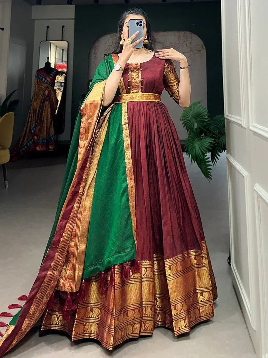Maroon and green designer lehenga choli with gold embroidery, perfect for Indian ethnic wear occasions.