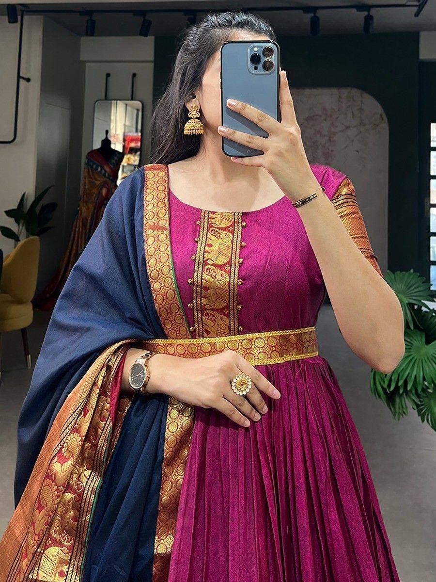 Purple ethnic gown with gold embroidery and blue dupatta, perfect for Indian occasions
