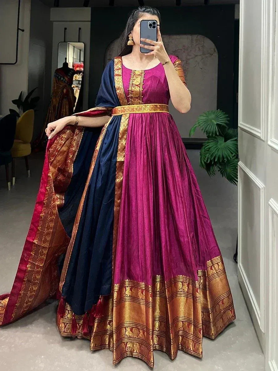 Elegant magenta and navy blue ethnic gown with golden zari border, perfect for Indian festive occasions.