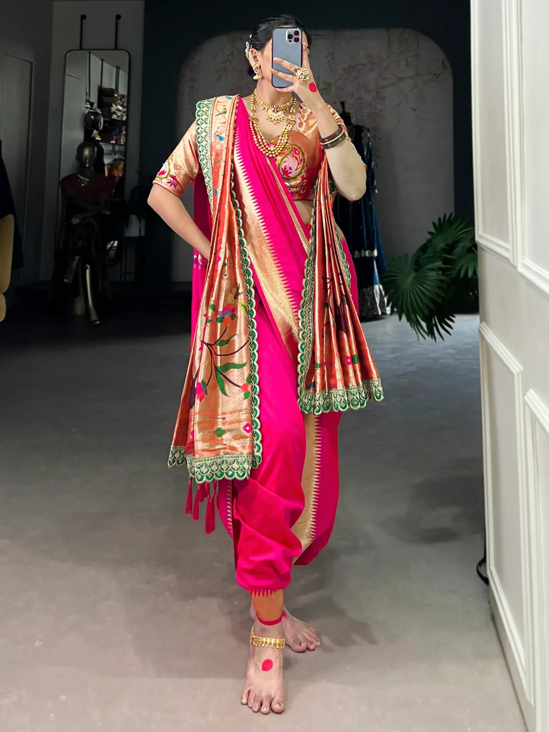 Vibrant pink dhoti saree with floral embroidered dupatta, perfect for Indian ethnic wear occasions.