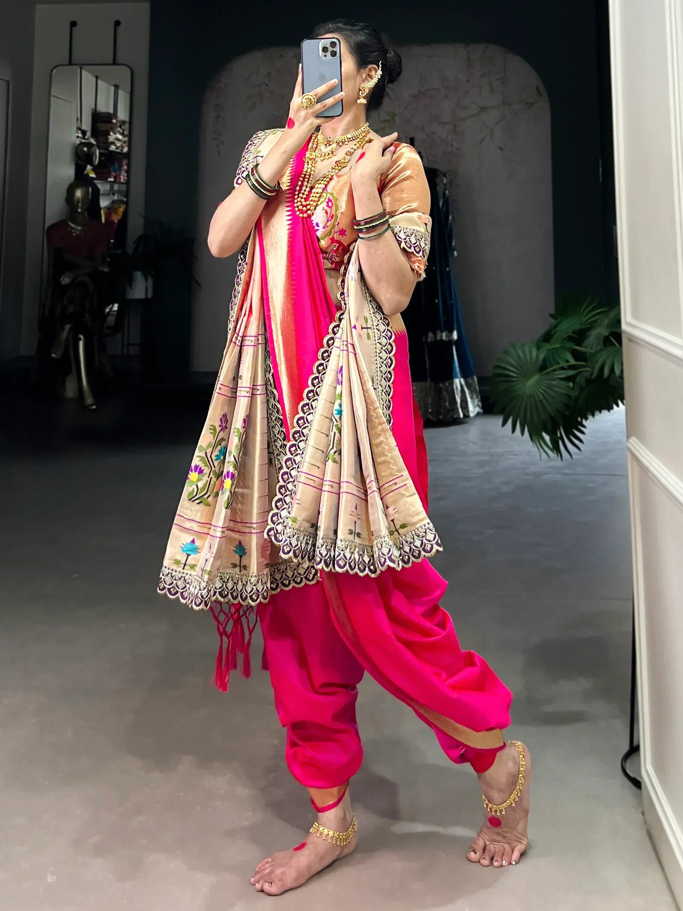 Vibrant pink dhoti pants with embroidered beige dupatta, perfect for Indian ethnic wear.
