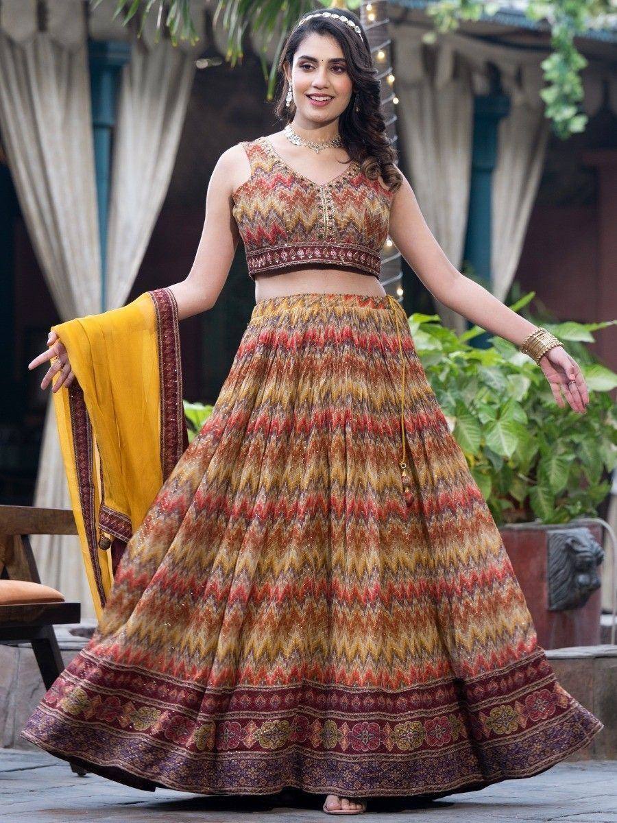 Woman in vibrant printed lehenga choli with yellow dupatta, perfect for Indian ethnic occasions