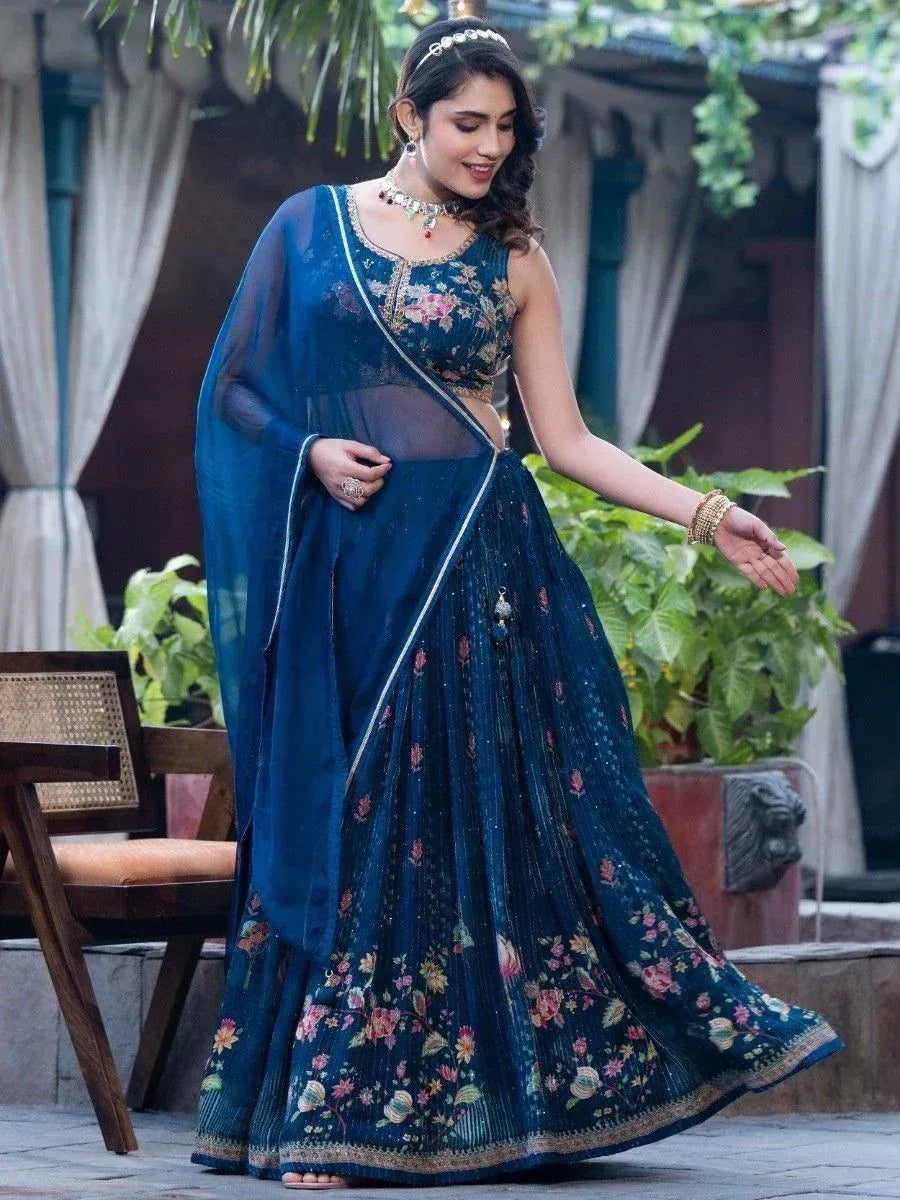 Woman in navy blue floral lehenga choli with sheer dupatta, perfect for Indian ethnic occasions