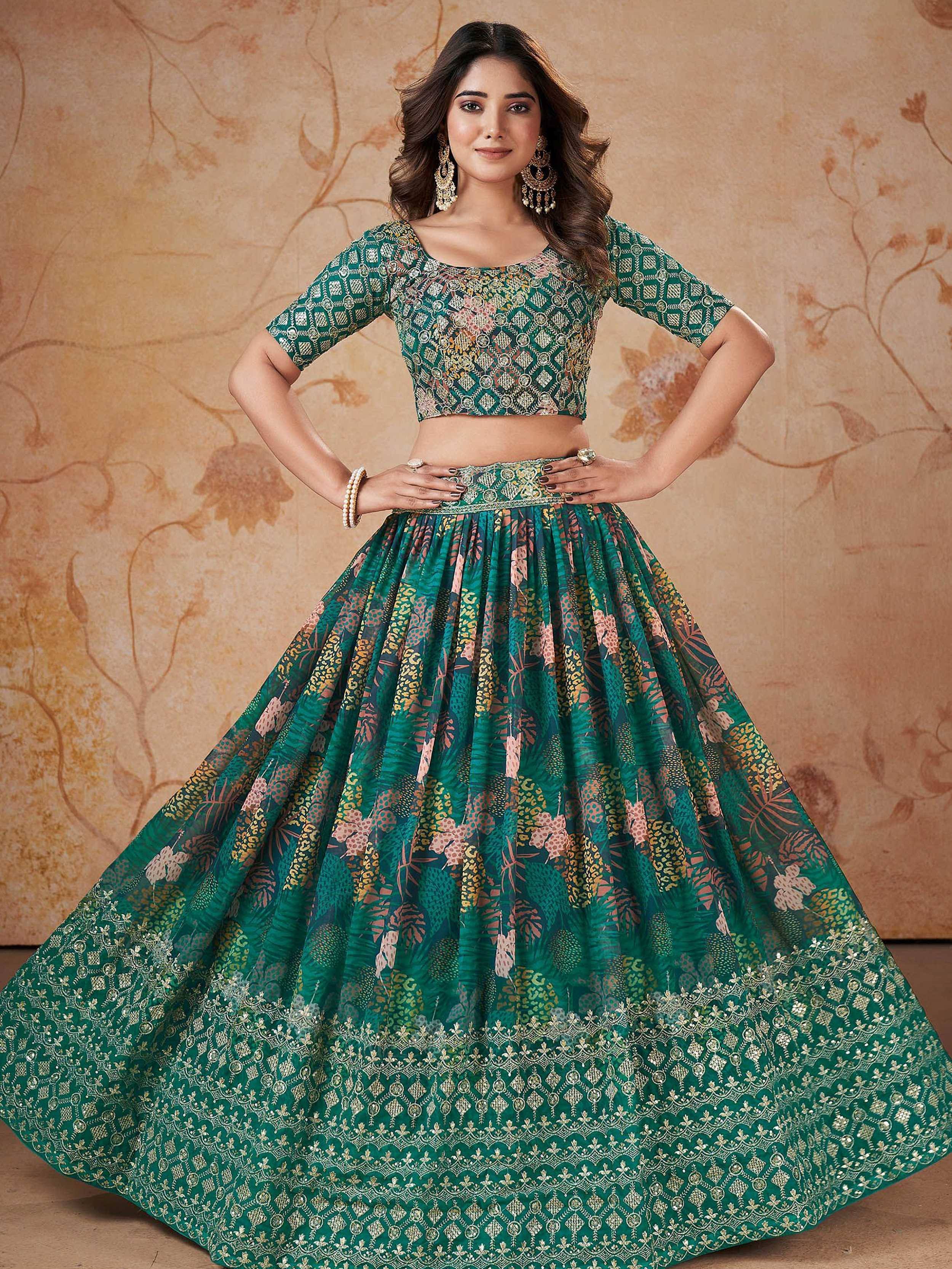 Emerald green printed lehenga choli with gold embroidery, perfect for Indian ethnic wear occasions.