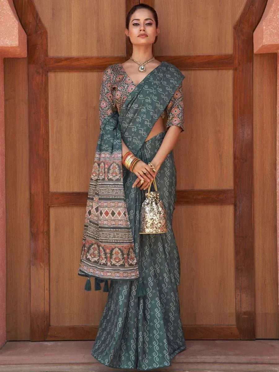 Green printed saree with ethnic blouse and sequin potli bag, perfect for Indian occasions
