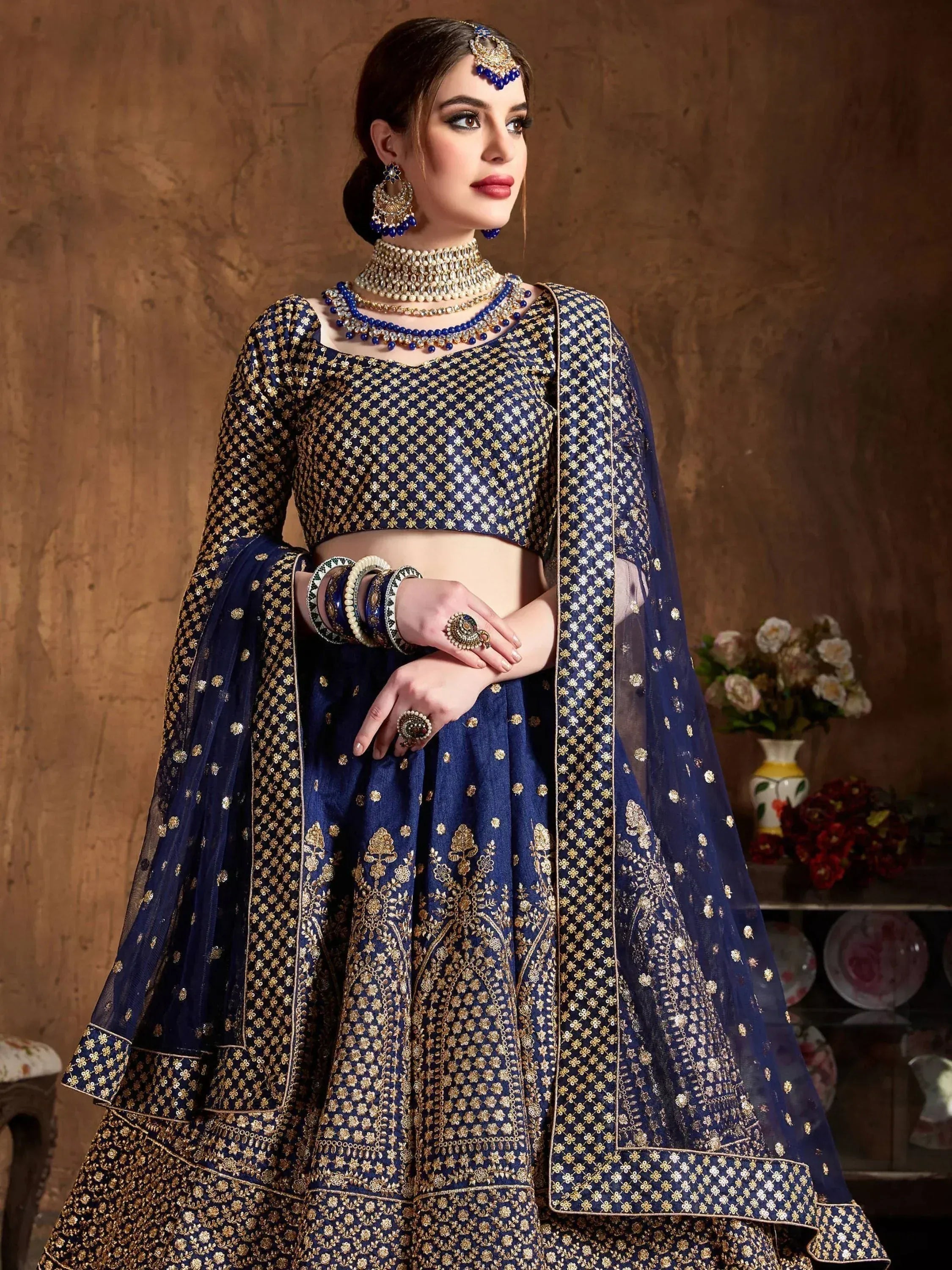 Royal blue designer lehenga choli with gold embroidery, perfect for weddings and festive occasions