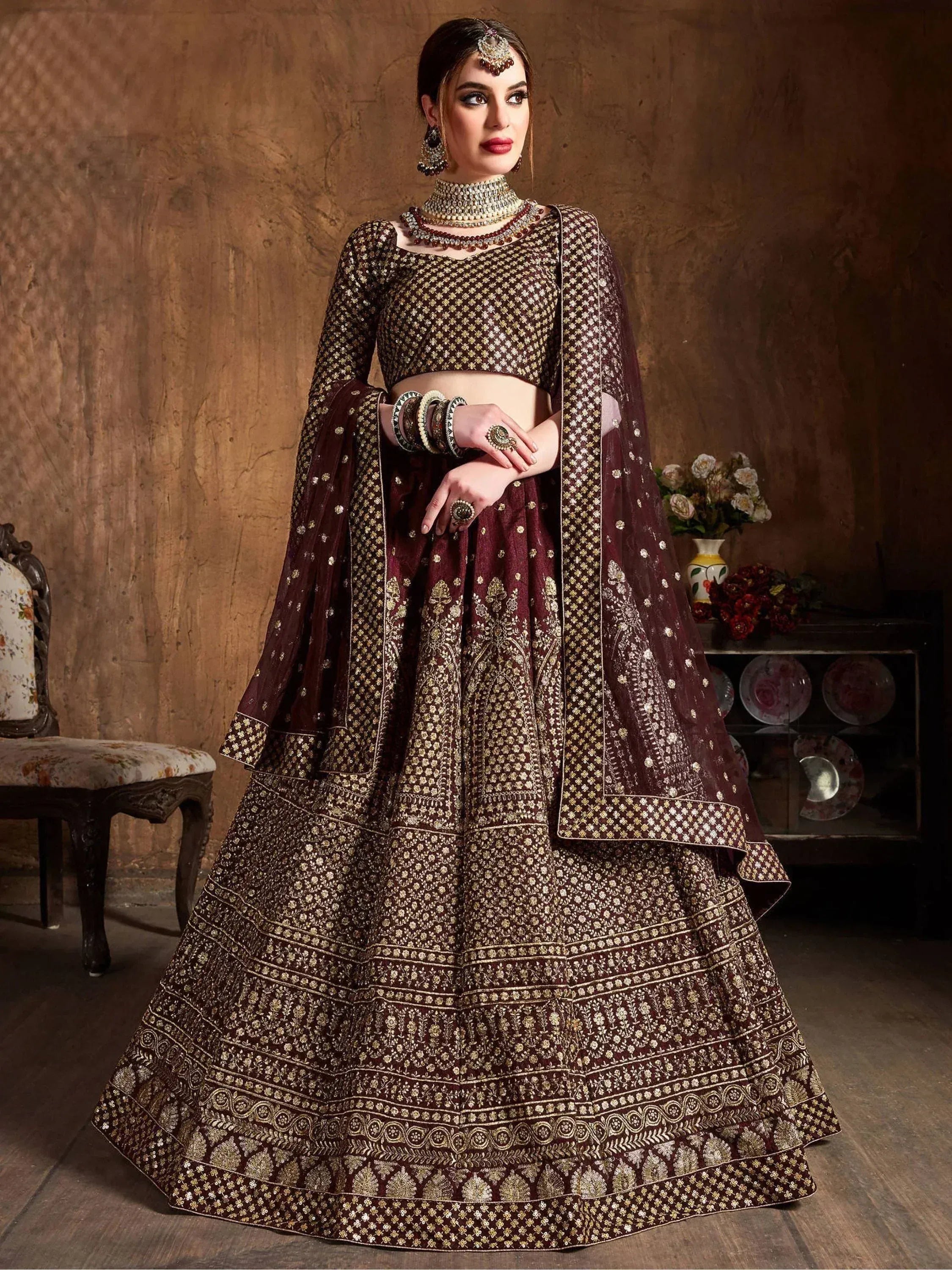 Maroon designer lehenga choli with gold embroidery, perfect for Indian weddings and festive occasions